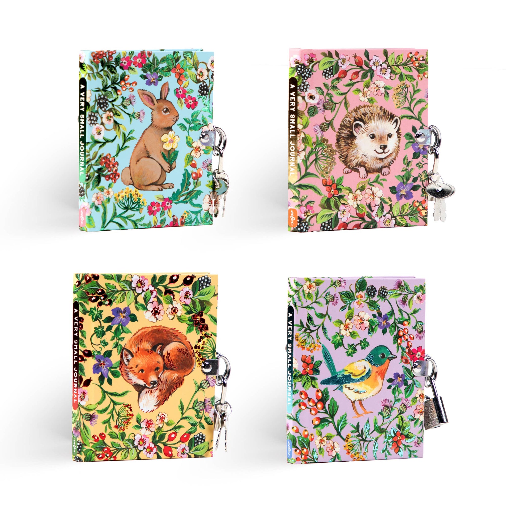 Four colorful journals with animal illustrations and keychains on a white background