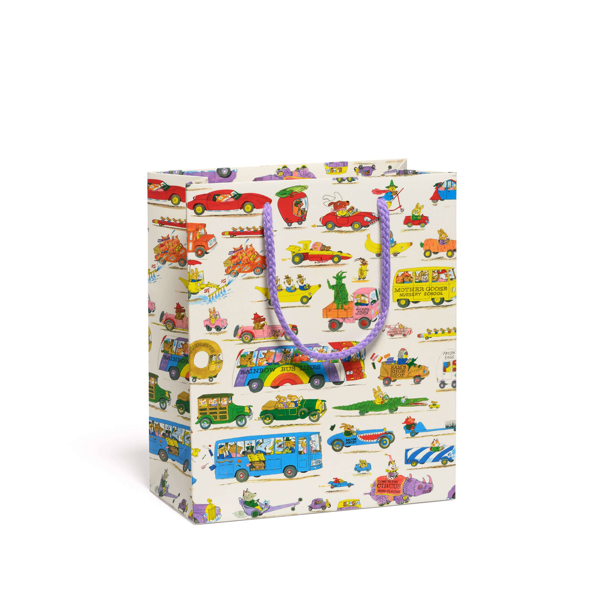 A cream-colored gift bag featuring a colorful vintage-style illustration pattern of buses, cars, and whimsical characters, complete with purple and blue patterned paper handles.