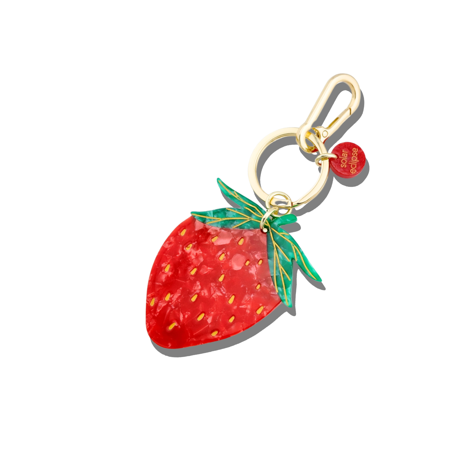 Strawberry-shaped keychain with a gold clasp on a white background
