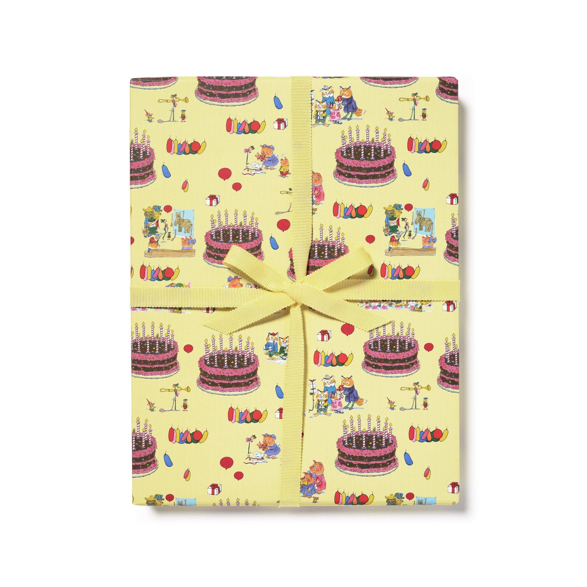 Gift wrap with birthday cake and teddy bear design on a yellow background
