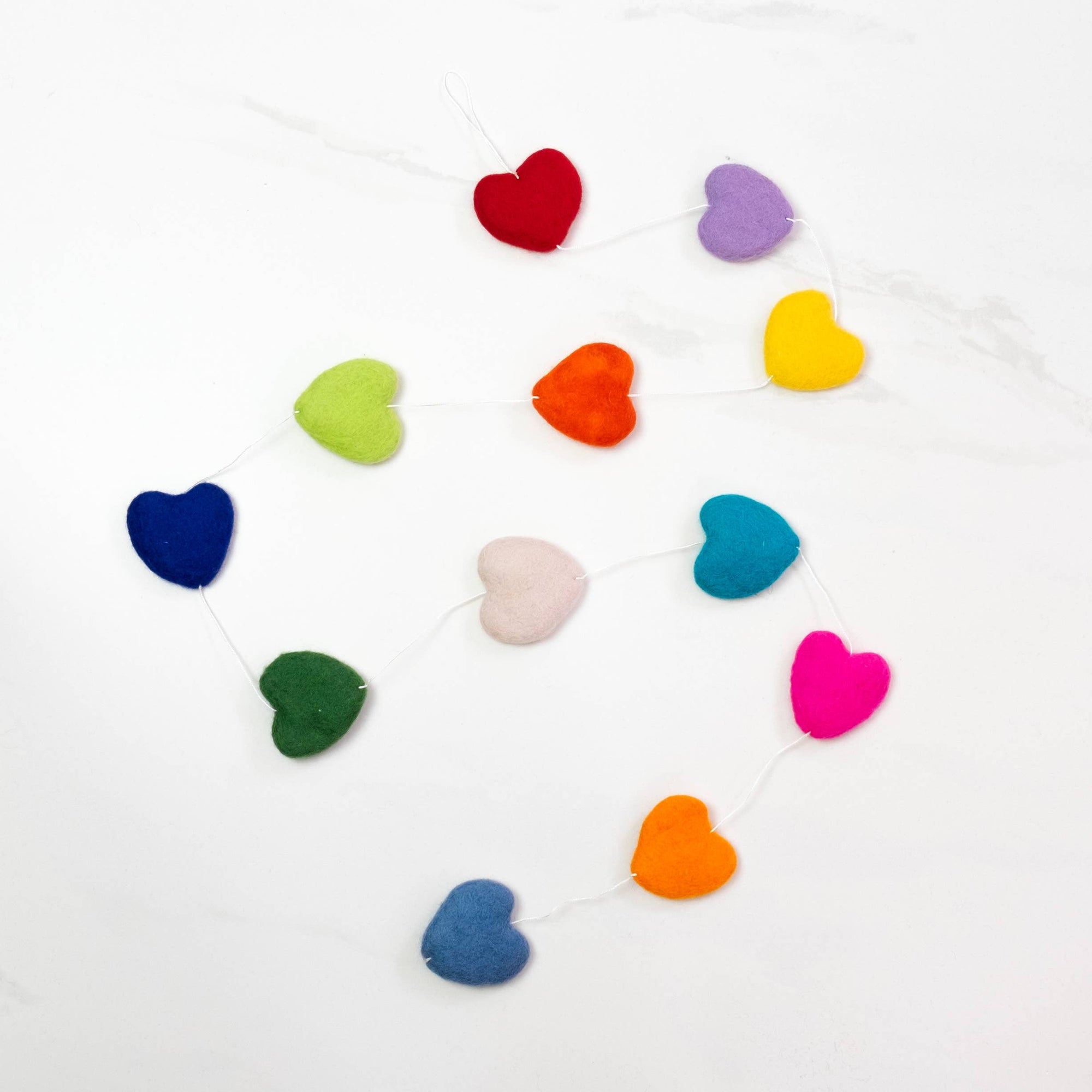 Colorful heart-shaped garland on a white background