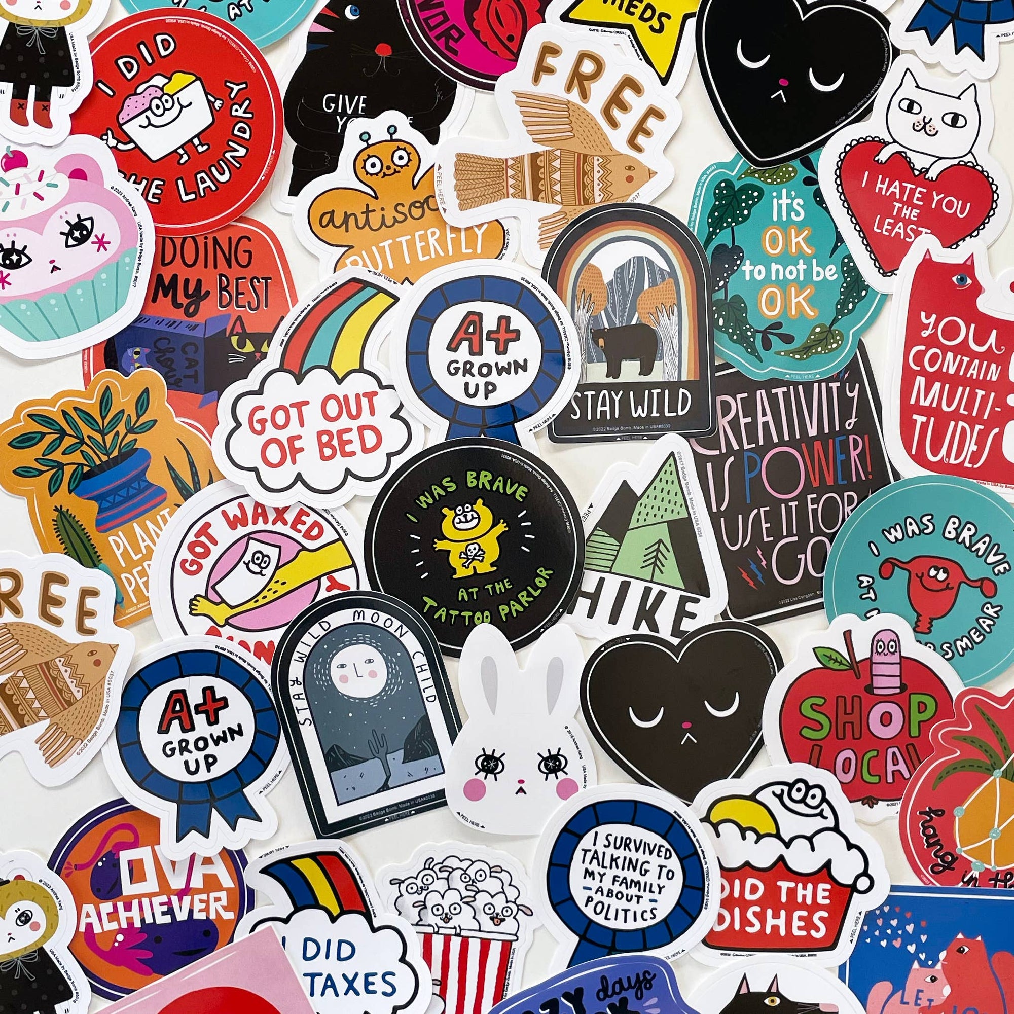 Collection of various colorful stickers with different designs and text.