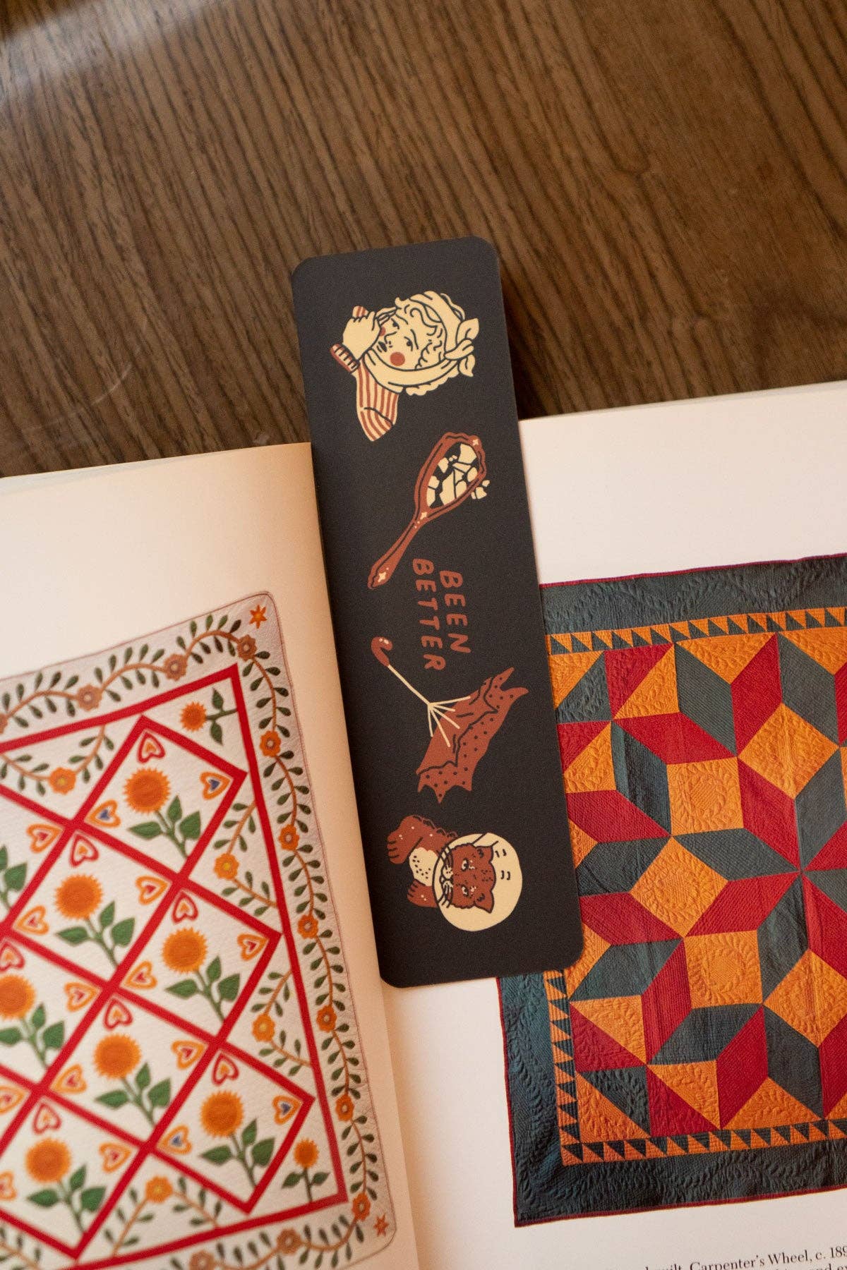 Decorative bookmark with illustrations on a book with geometric patterns