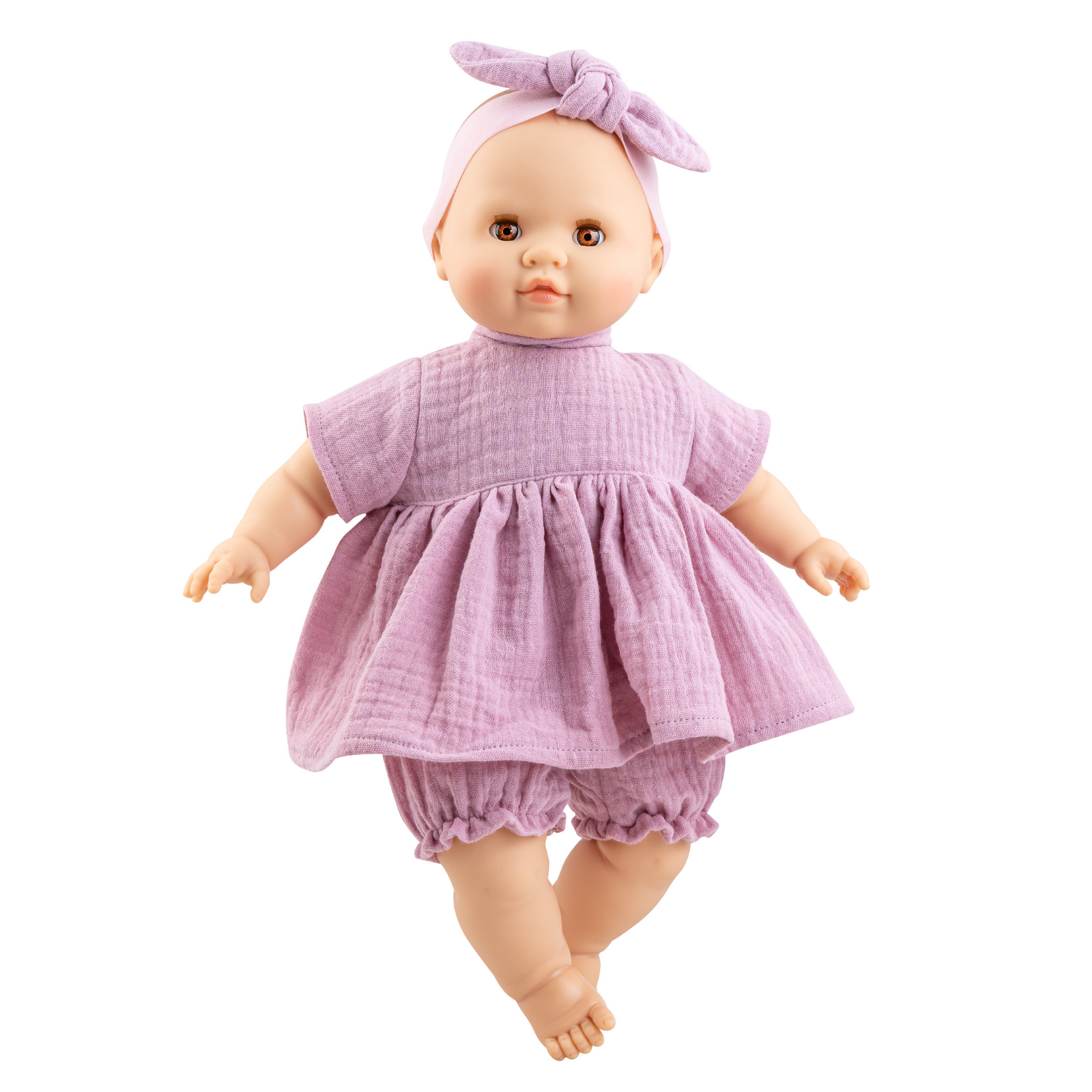 Doll wearing a pink outfit with a matching headband on a white background