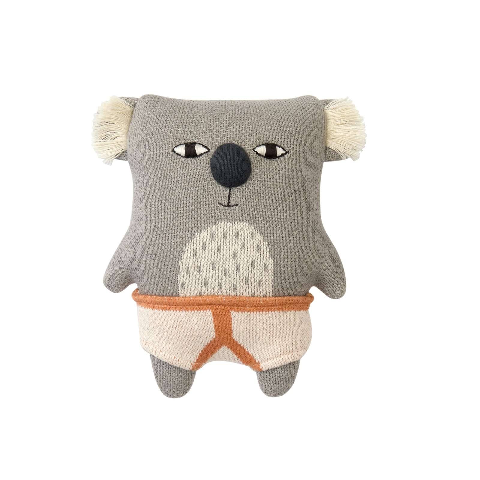 Knitted koala toy with a plain background