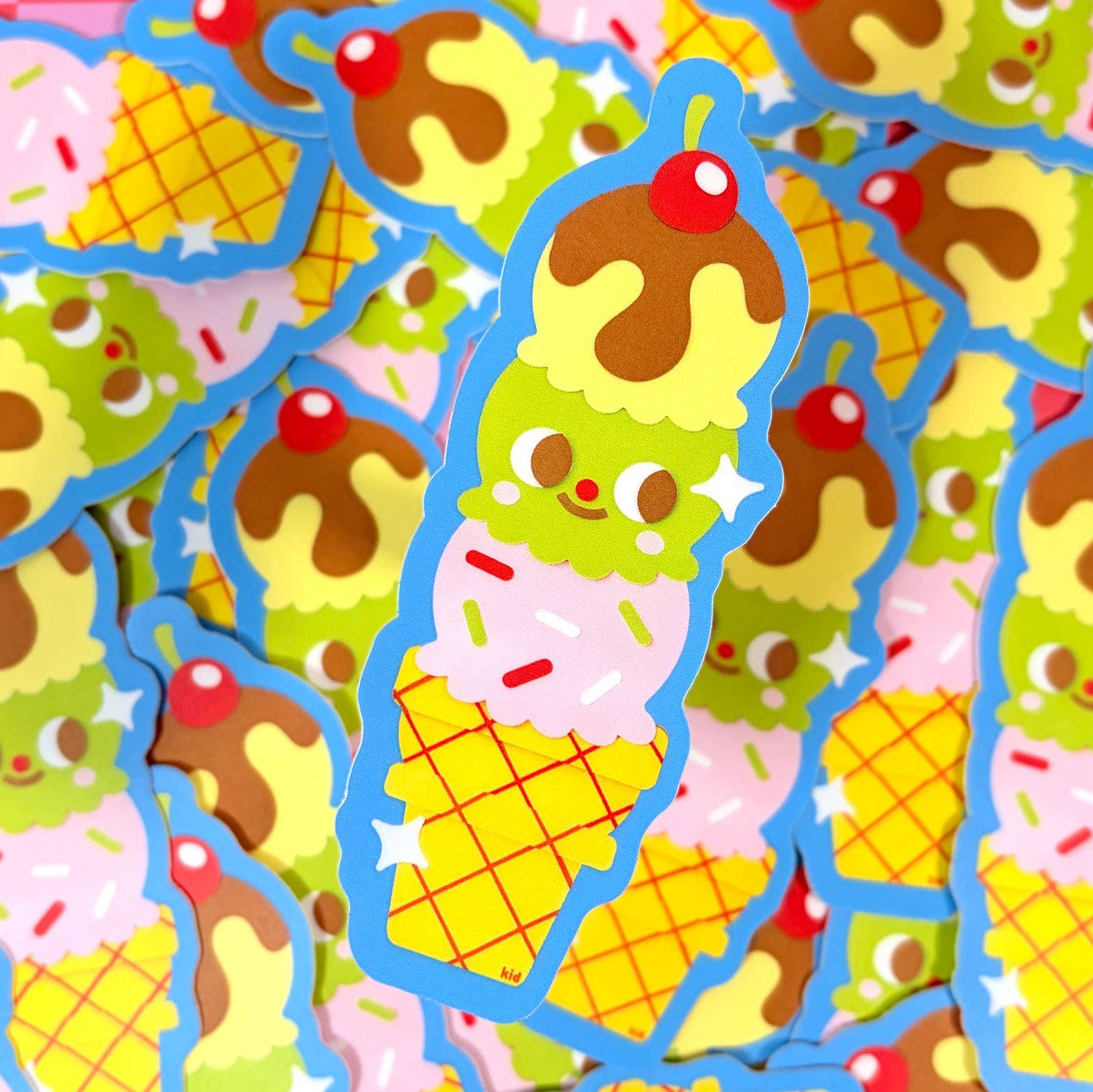 Colorful ice cream cone stickers with various flavors on a blue border.