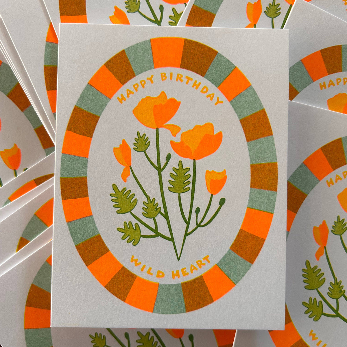 Stack of birthday cards with floral design and 'Happy Birthday' text