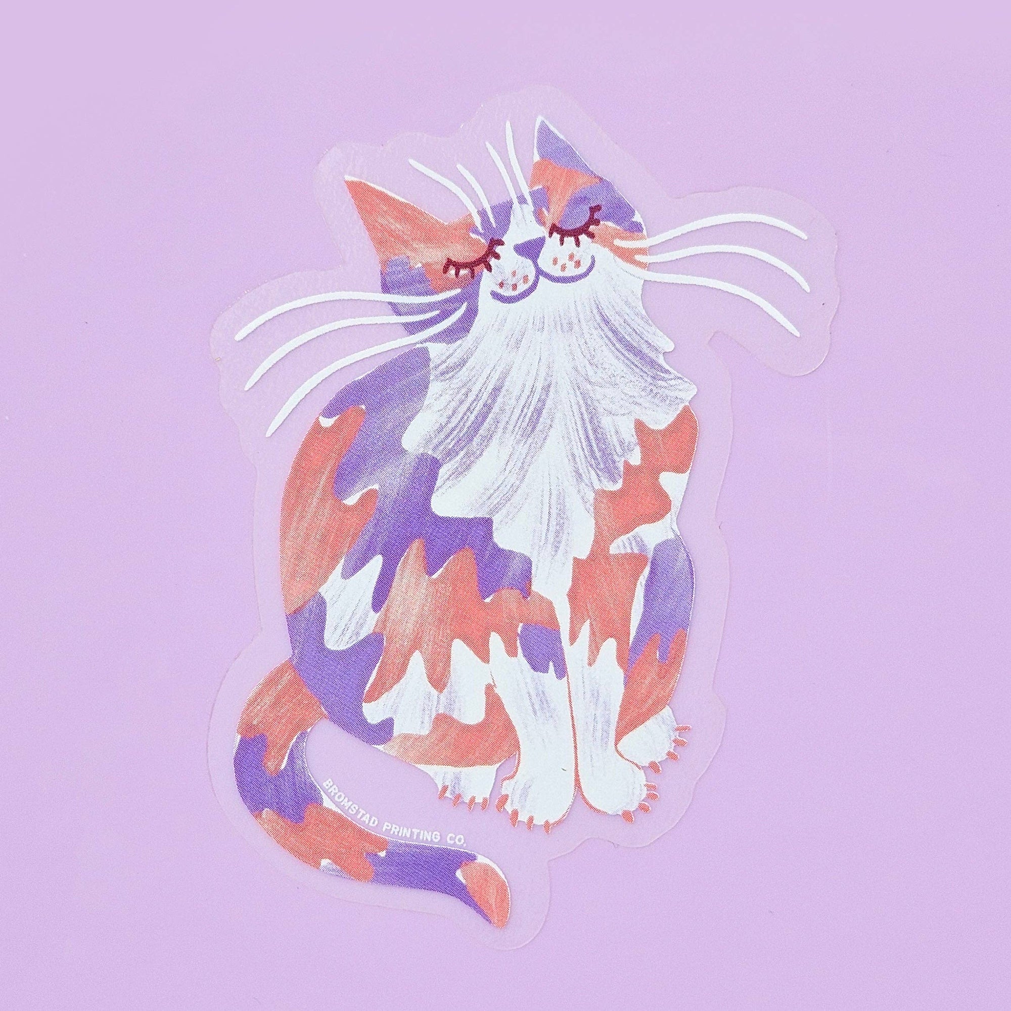 Colorful cat sticker on a light purple background