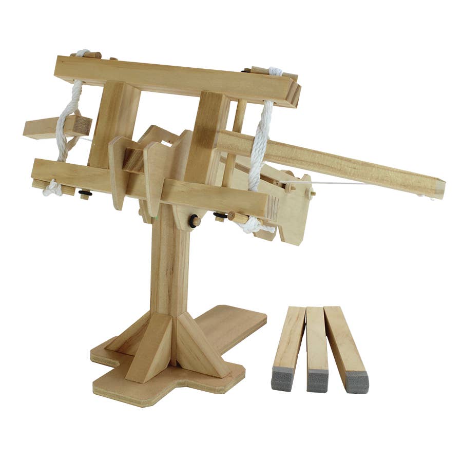 Wooden trebuchet model on a white background