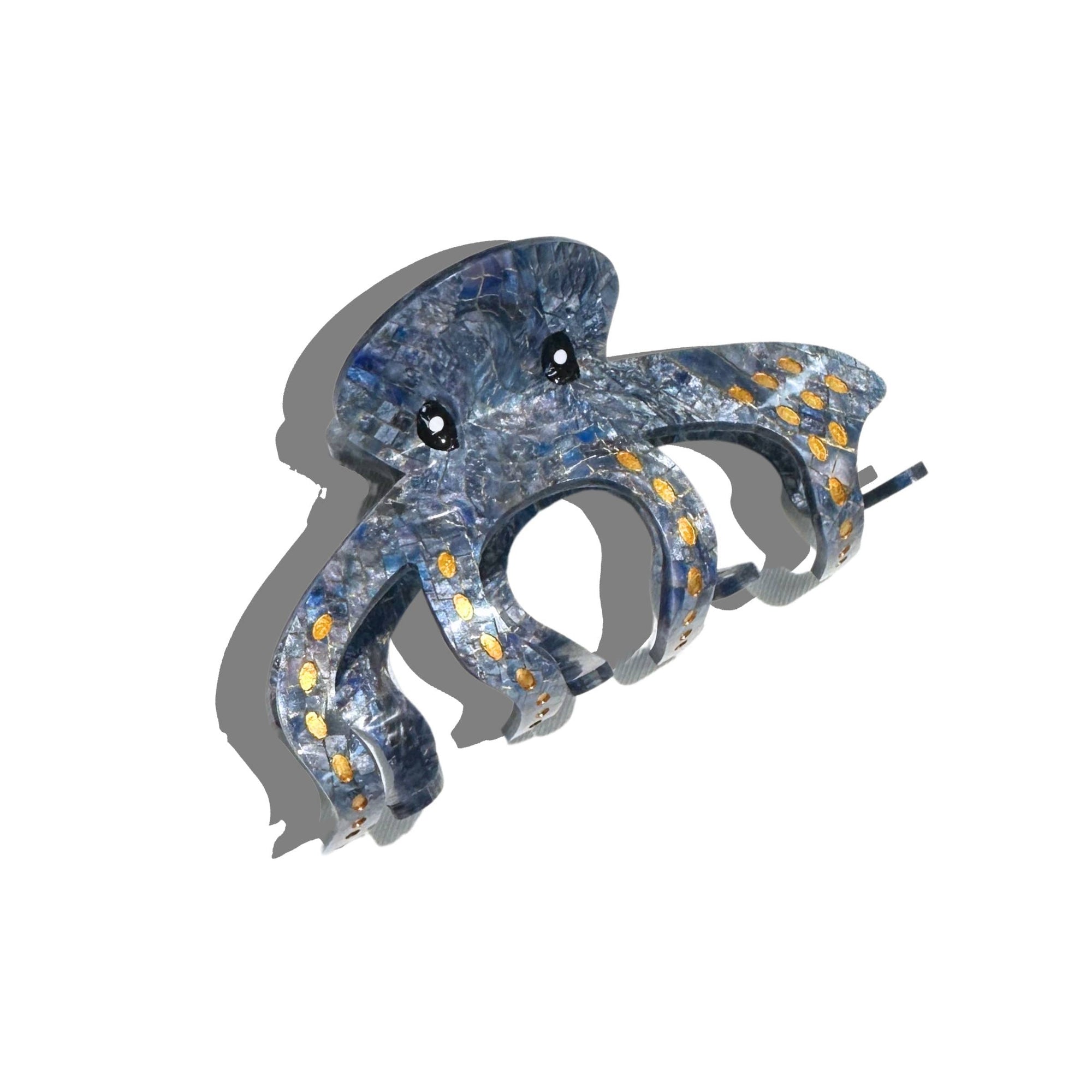 Decorative blue and silver fish-shaped ornament on a white background