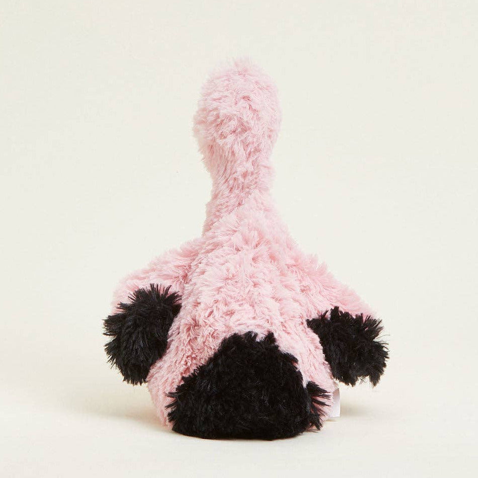 Pink and black plush toy on a white background