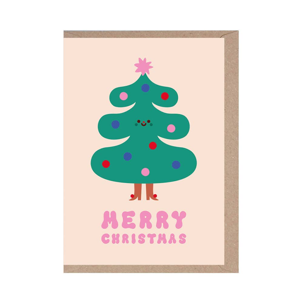 Christmas card with a cartoon Christmas tree and 'Merry Christmas' text on a light pink background.
