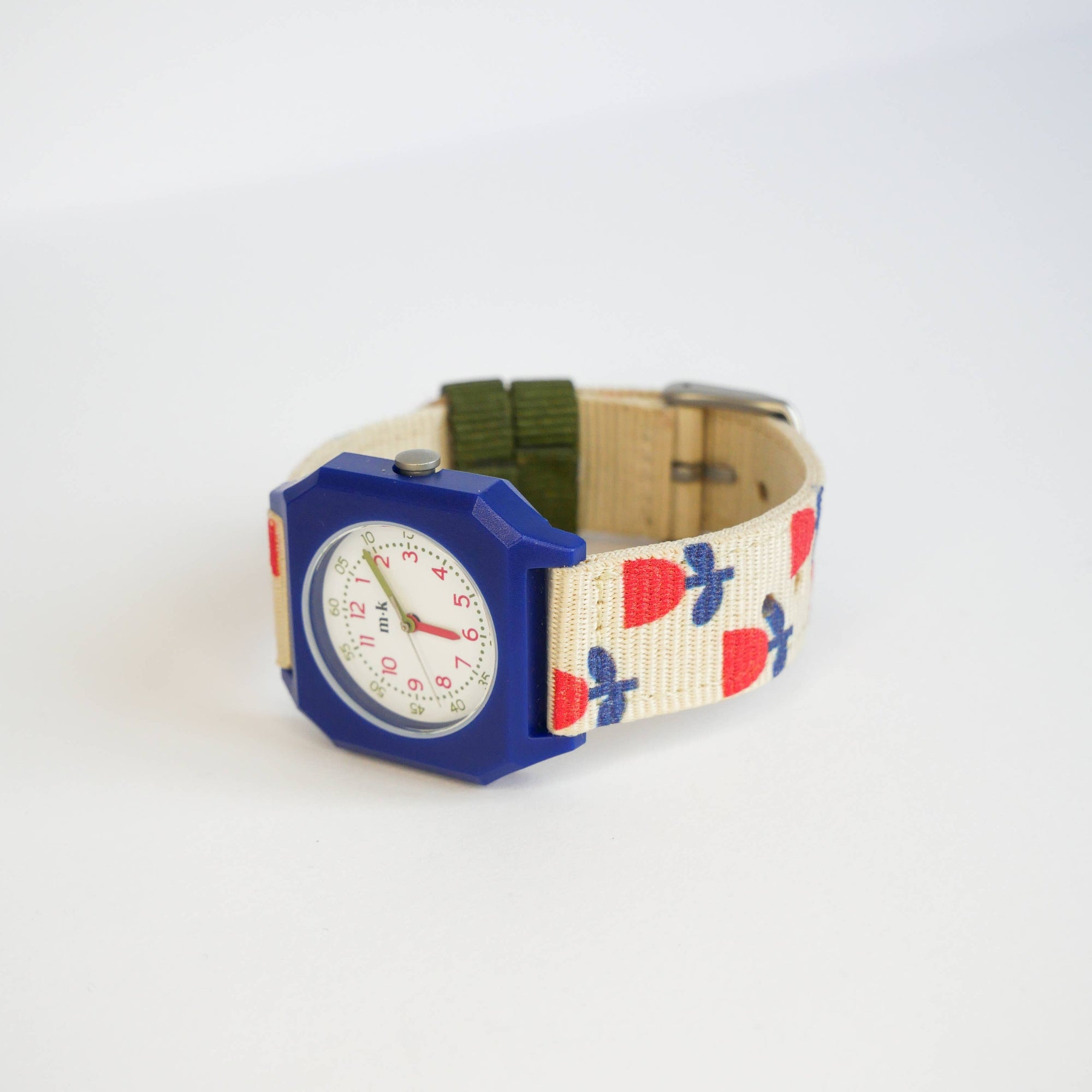 Colorful watch with a patterned strap on a white background