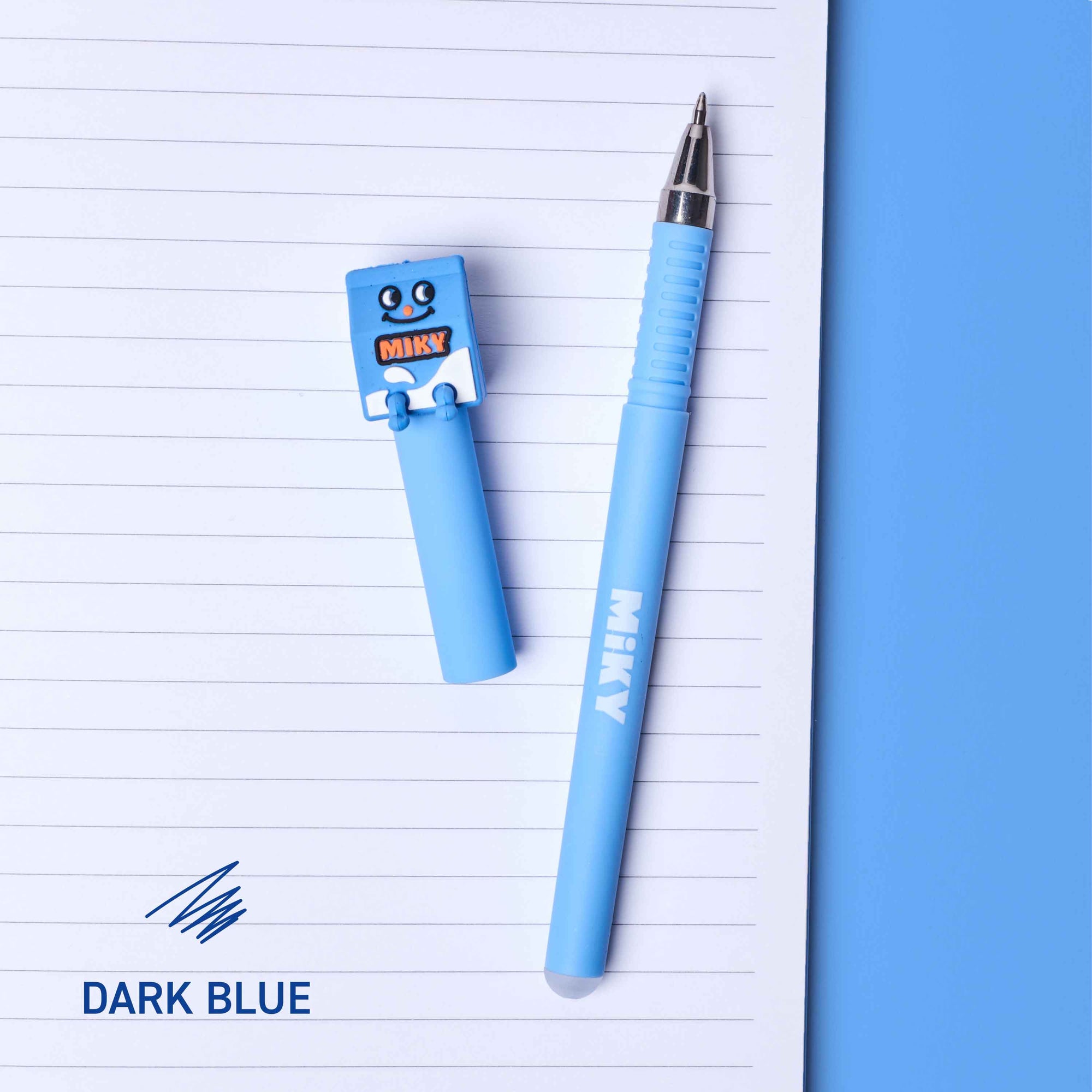 Light blue pen and blue cap on a lined notebook page with 'Mika' branding.