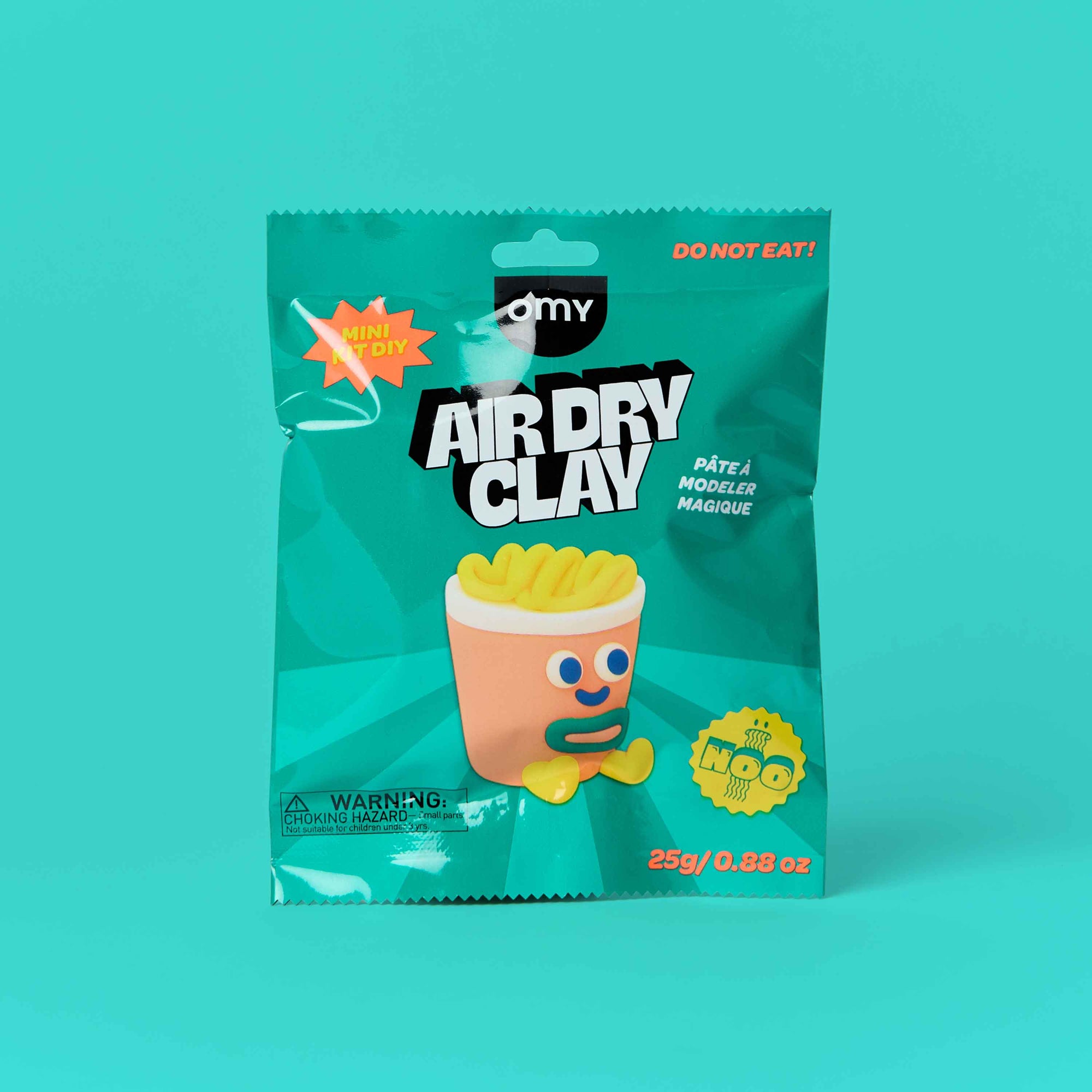 Package of Air Dry Clay with a cartoon character on a teal background