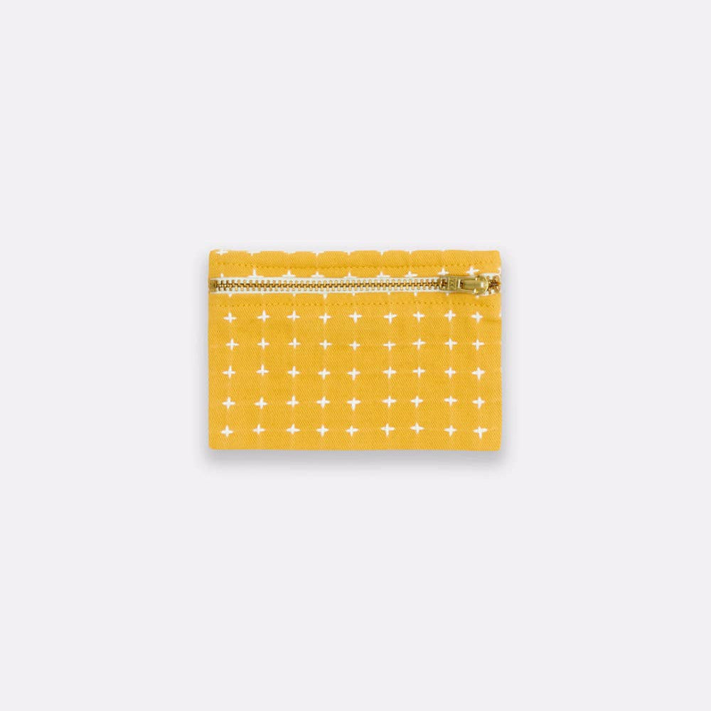Yellow pouch with white pattern on a white background