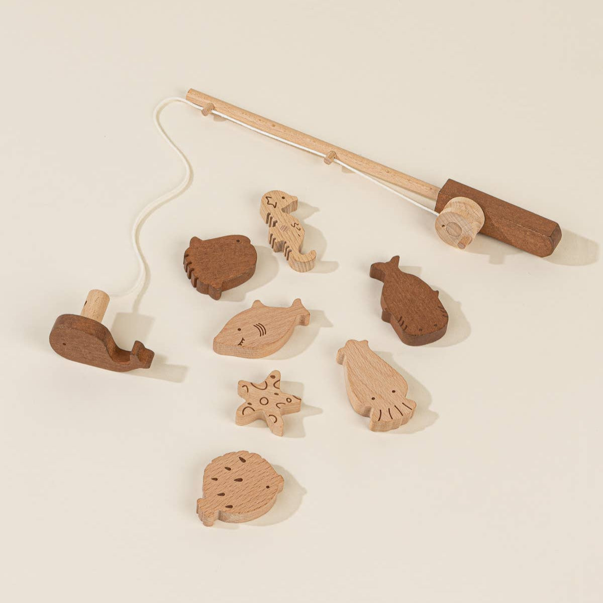 Wooden toy with various animal figures on a beige background