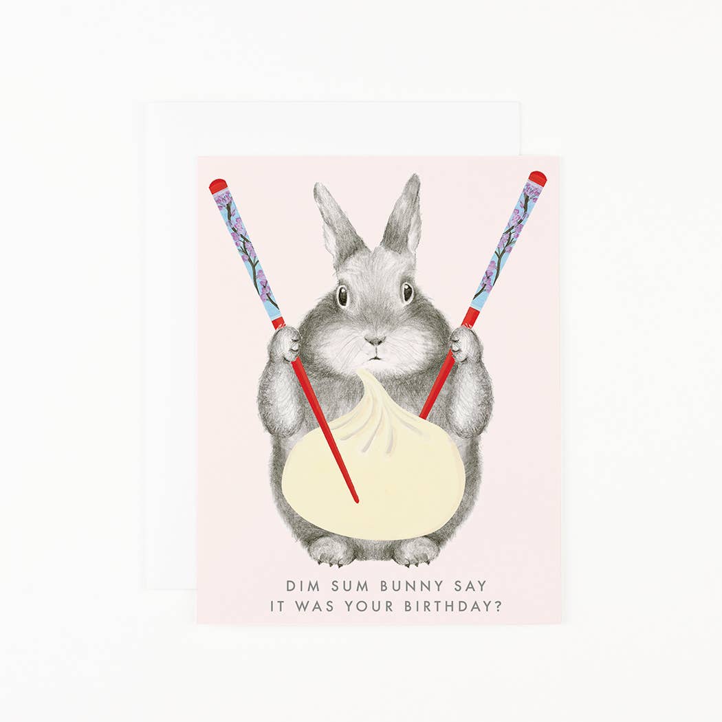 Illustration of a bunny holding chopsticks with dim sum, asking 'It was your birthday?' on a light pink background.