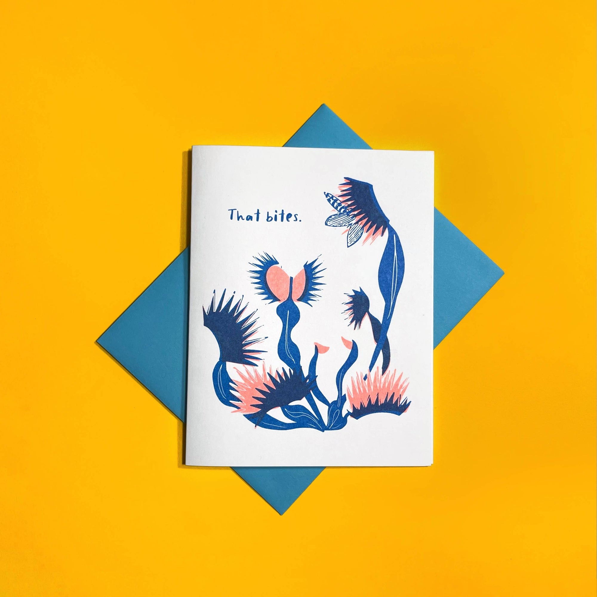 Greeting card with blue and pink floral design on a yellow background