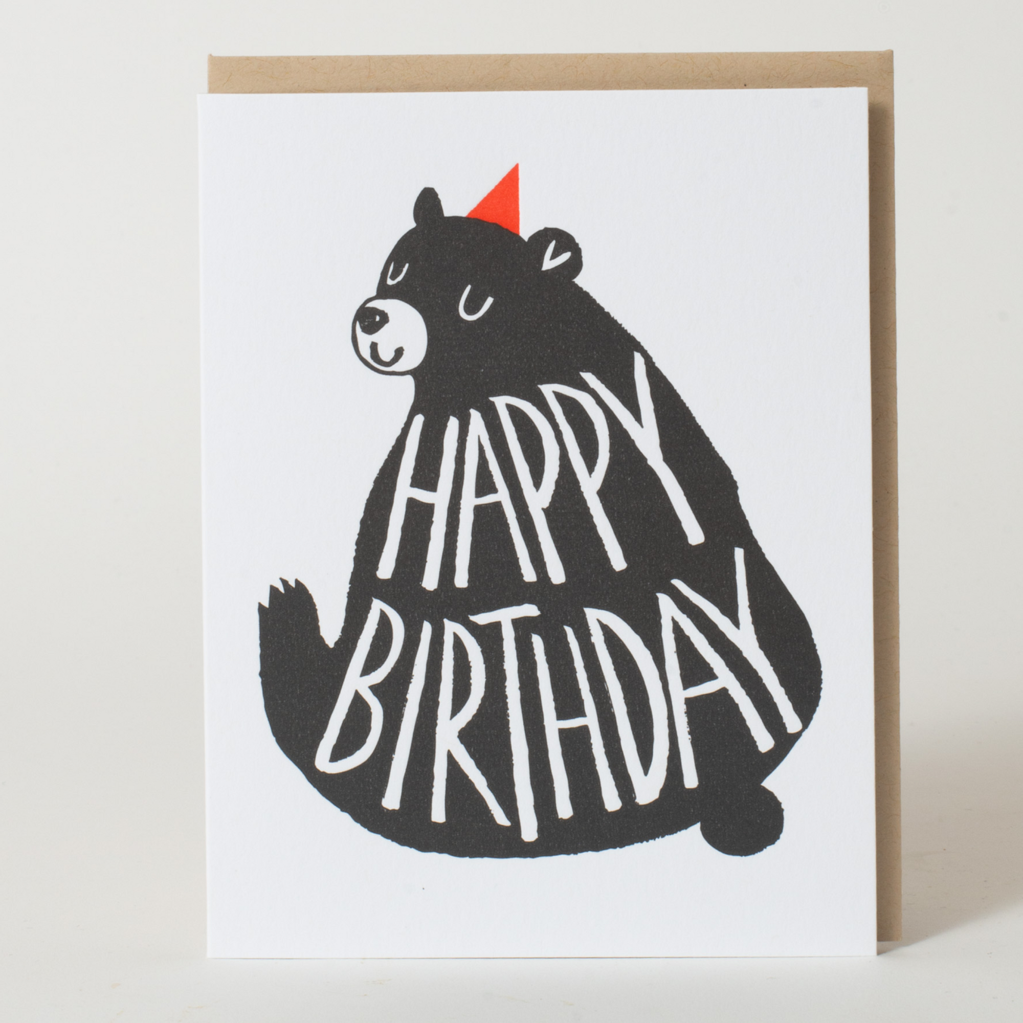 Greeting card with a bear illustration and 'Happy Birthday' text on a white background.