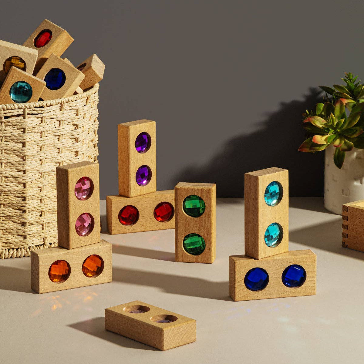 Wooden blocks with colored dots on a neutral background