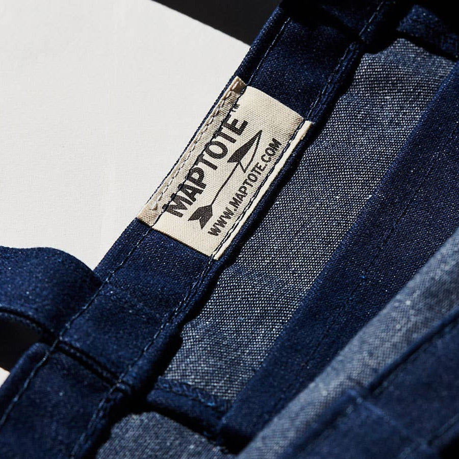 Naptote label on a blue denim bag