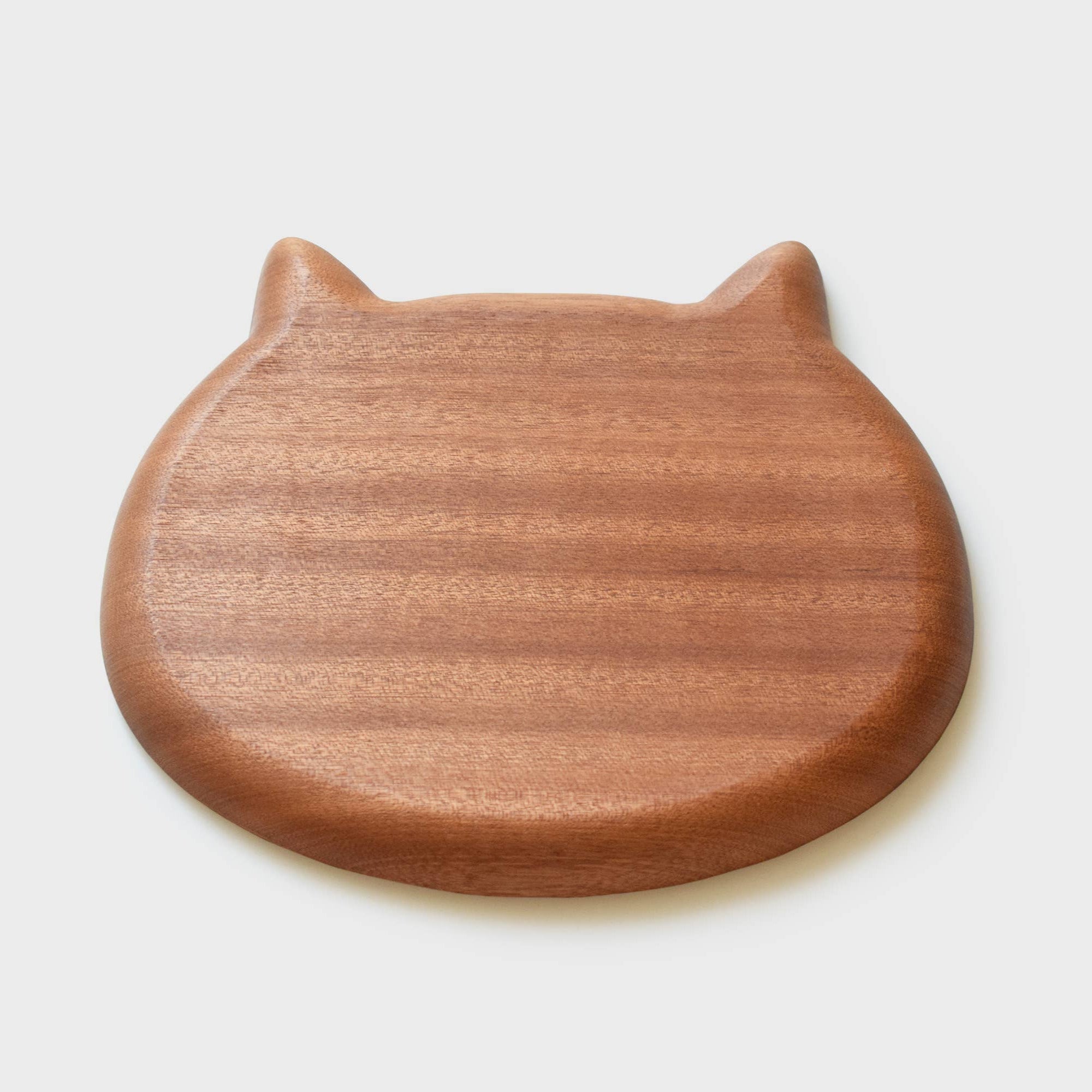 Wooden cat-shaped tray on a white background