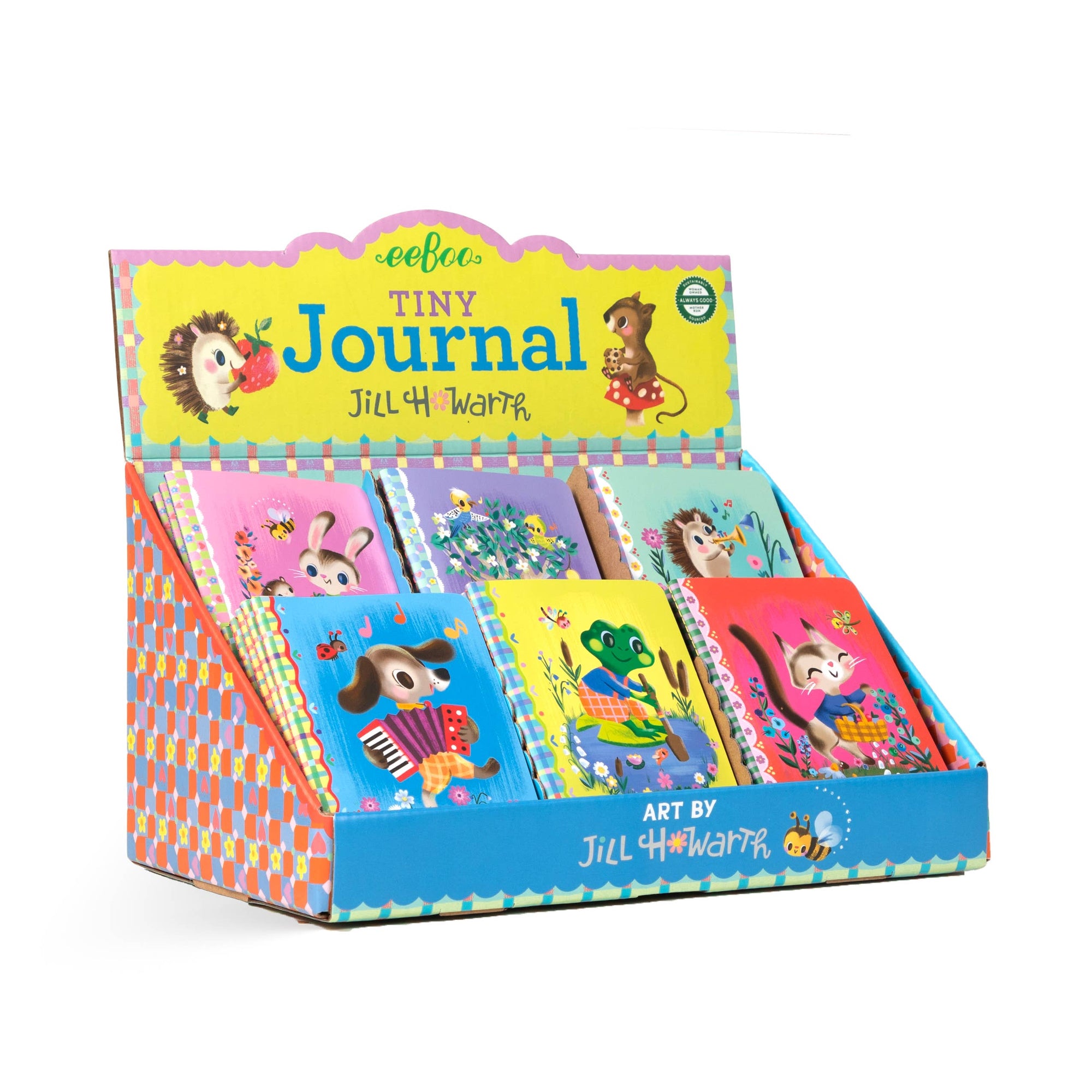 Display of 'Tiny Journal' books with colorful covers featuring animal illustrations, in a patterned box.