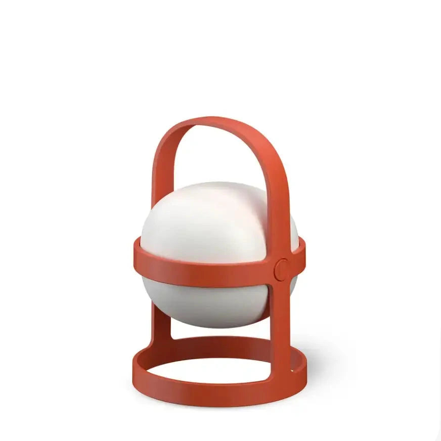 White ball with a red holder on a white background