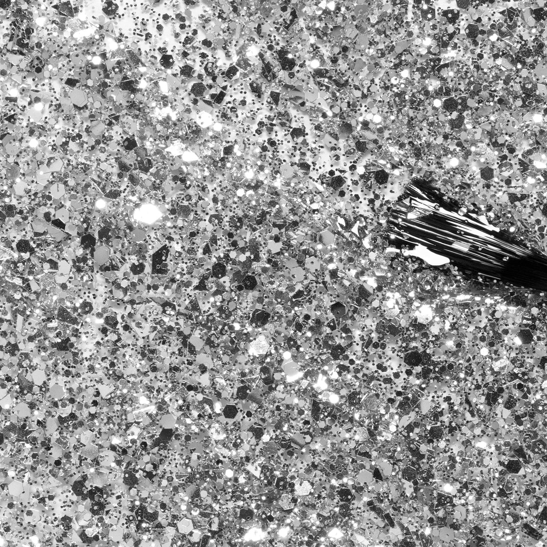 Close-up of a textured gray surface with a small object on it