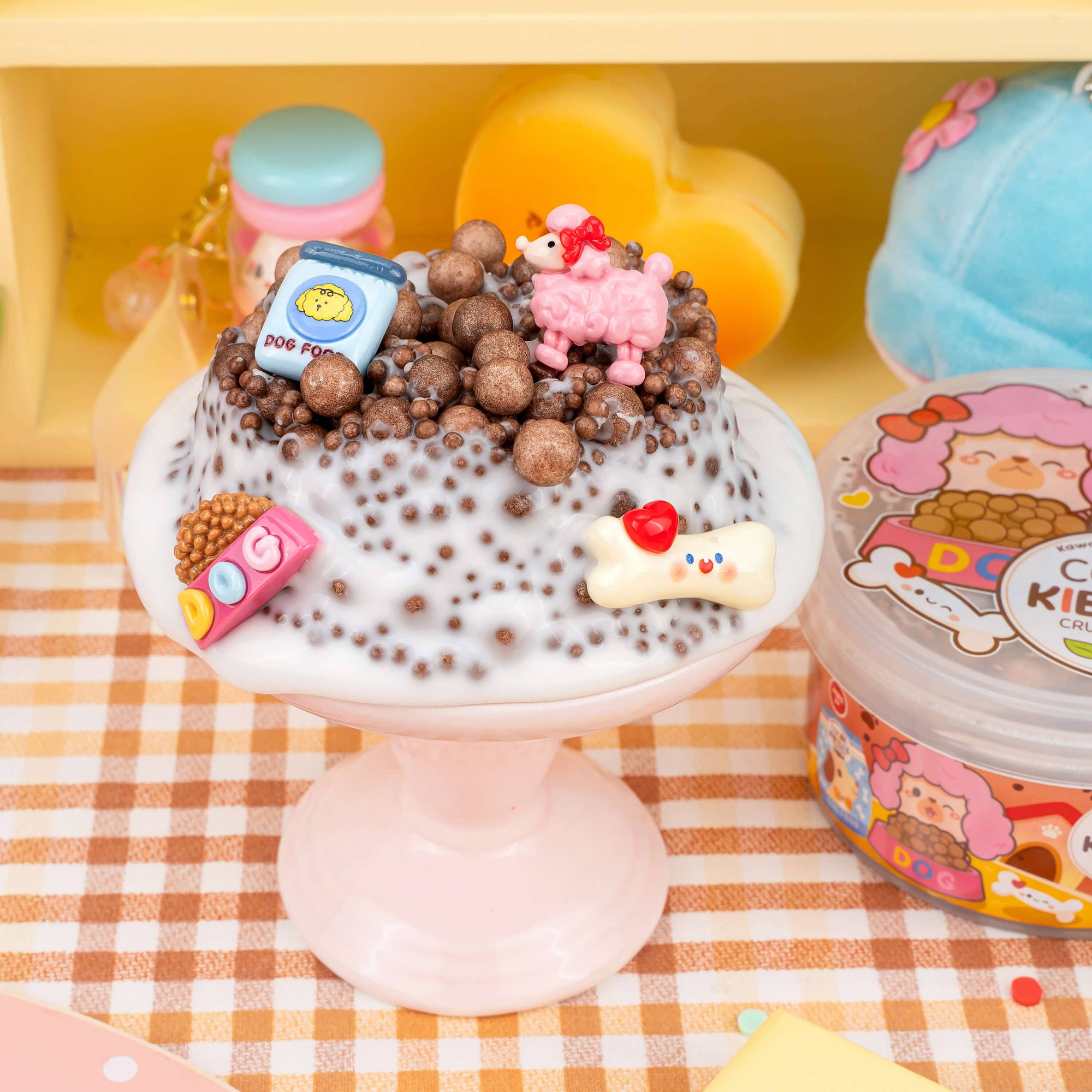 Cute dessert with animal-shaped toppings on a checkered tablecloth