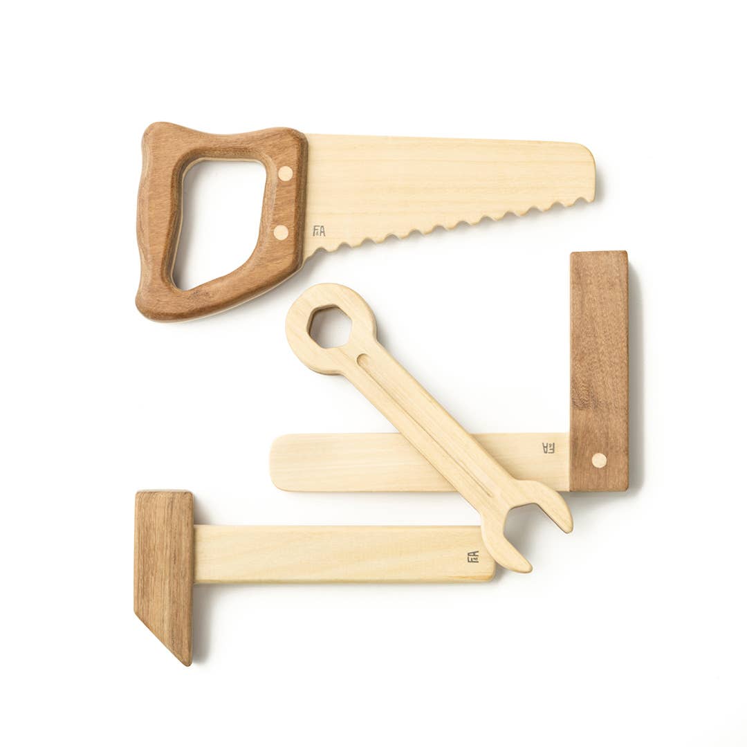 Set of three wooden tools with saw-like blades on a white background