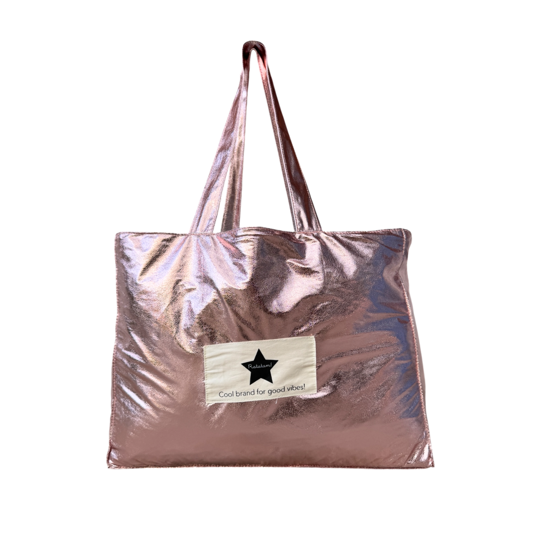Rose gold metallic tote bag with a visible brand label on a white background
