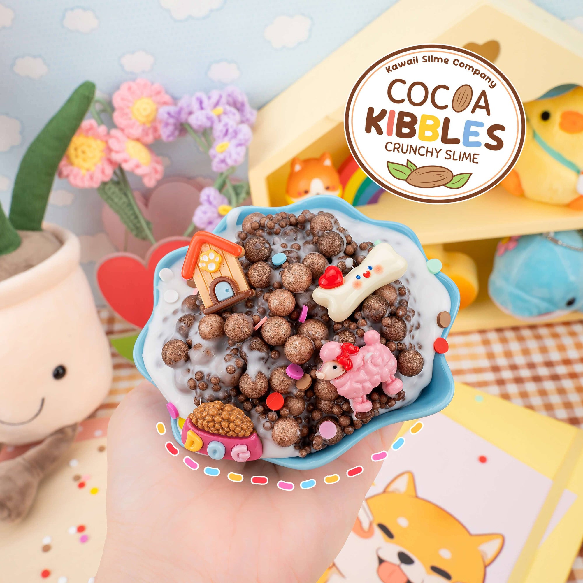 Cup of crunchy slime with decorative elements, held by a hand, against a colorful background with 'Cocoa Kibbles' branding.