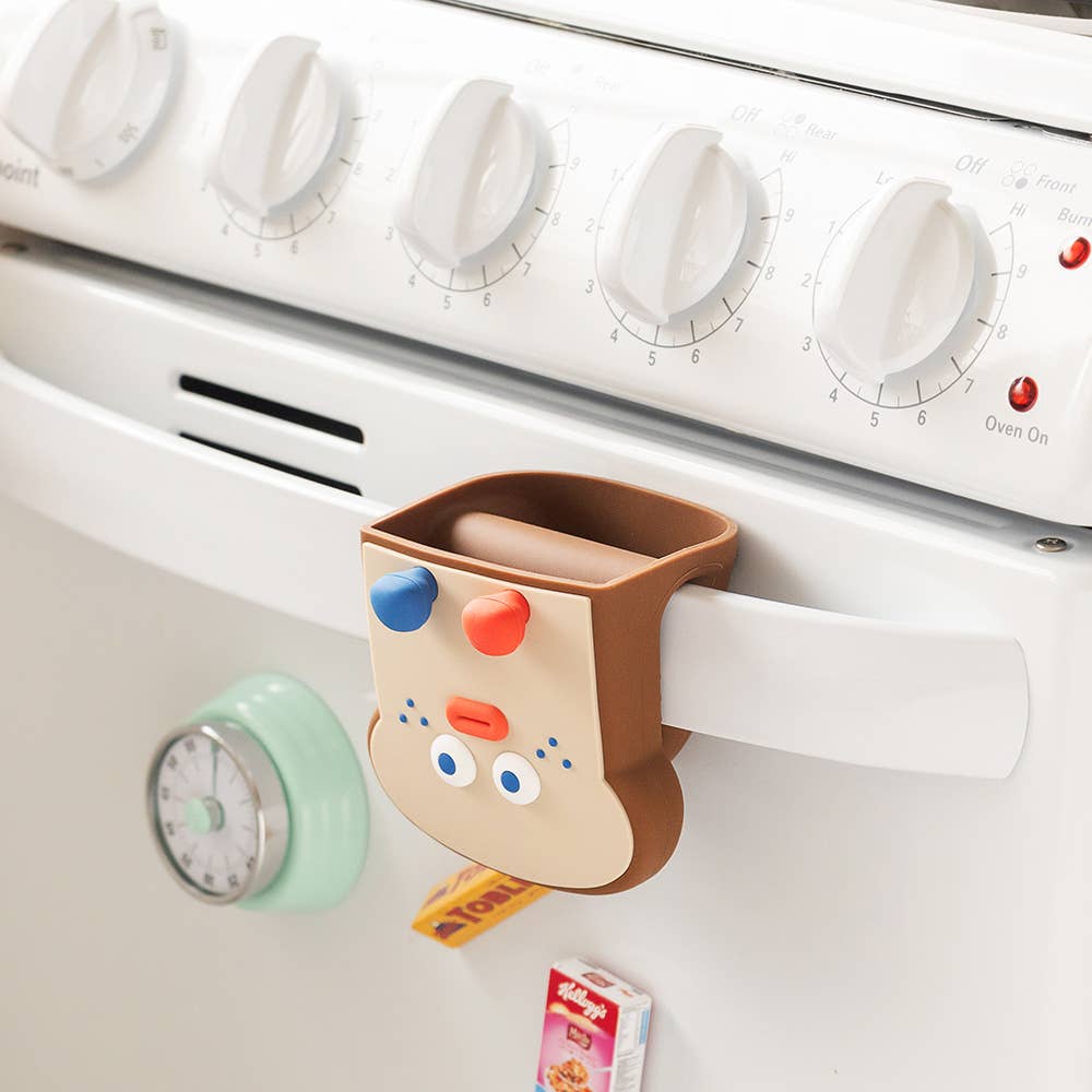 Kitchen appliance with a cute animal-shaped holder attached to it.