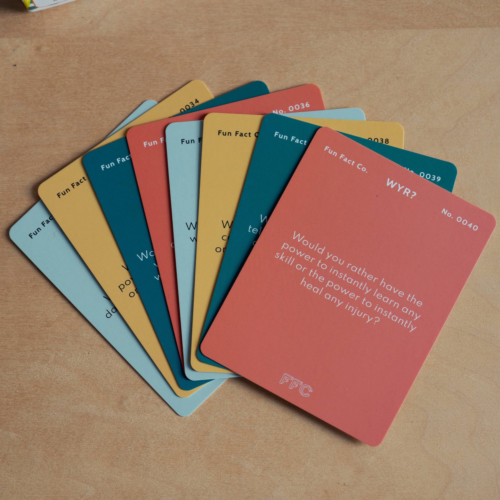 Set of colorful cards with text on a wooden surface
