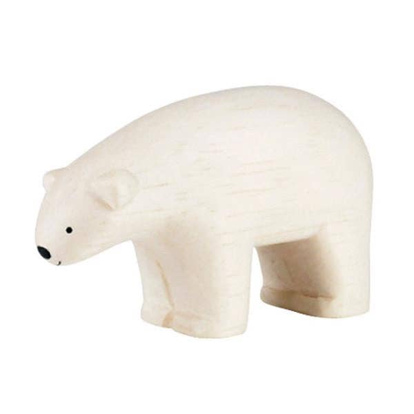 White polar bear figurine on a white background