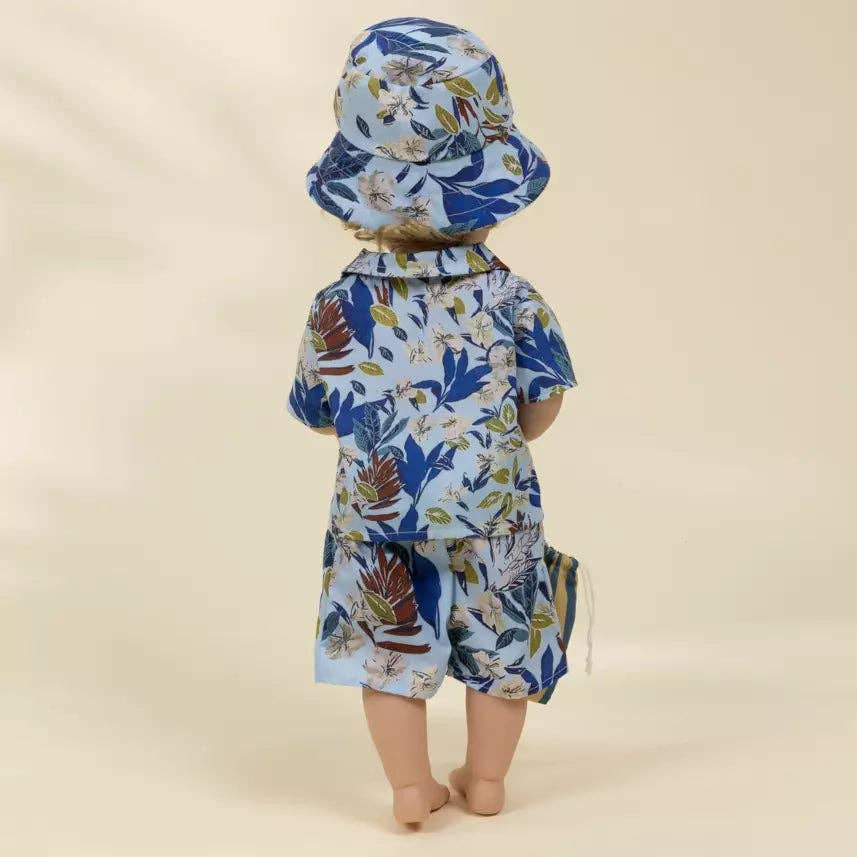 Doll wearing a floral outfit with a hat on a beige background