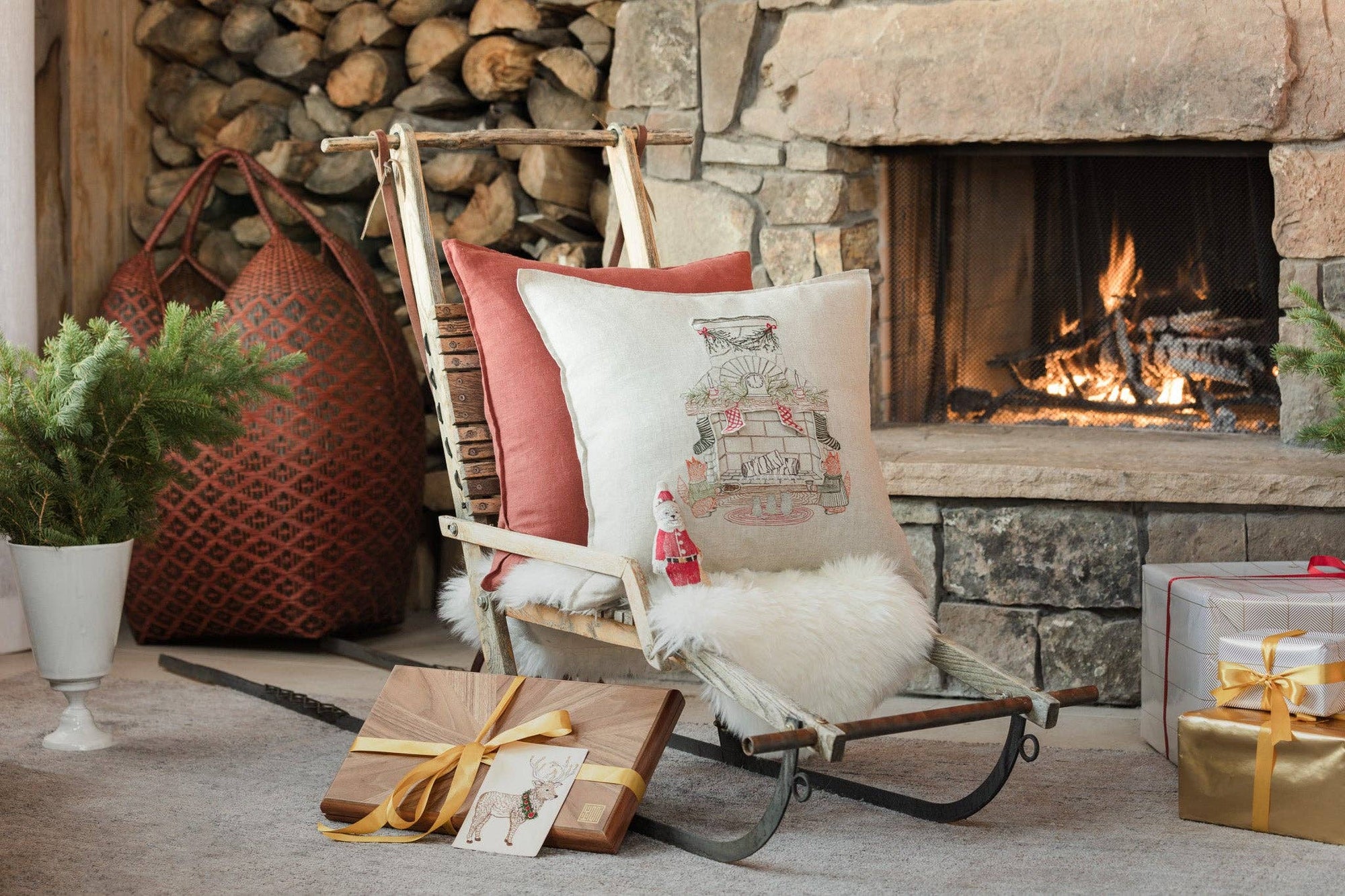 Cozy living room with a stone fireplace, rocking chair, and decorative items.