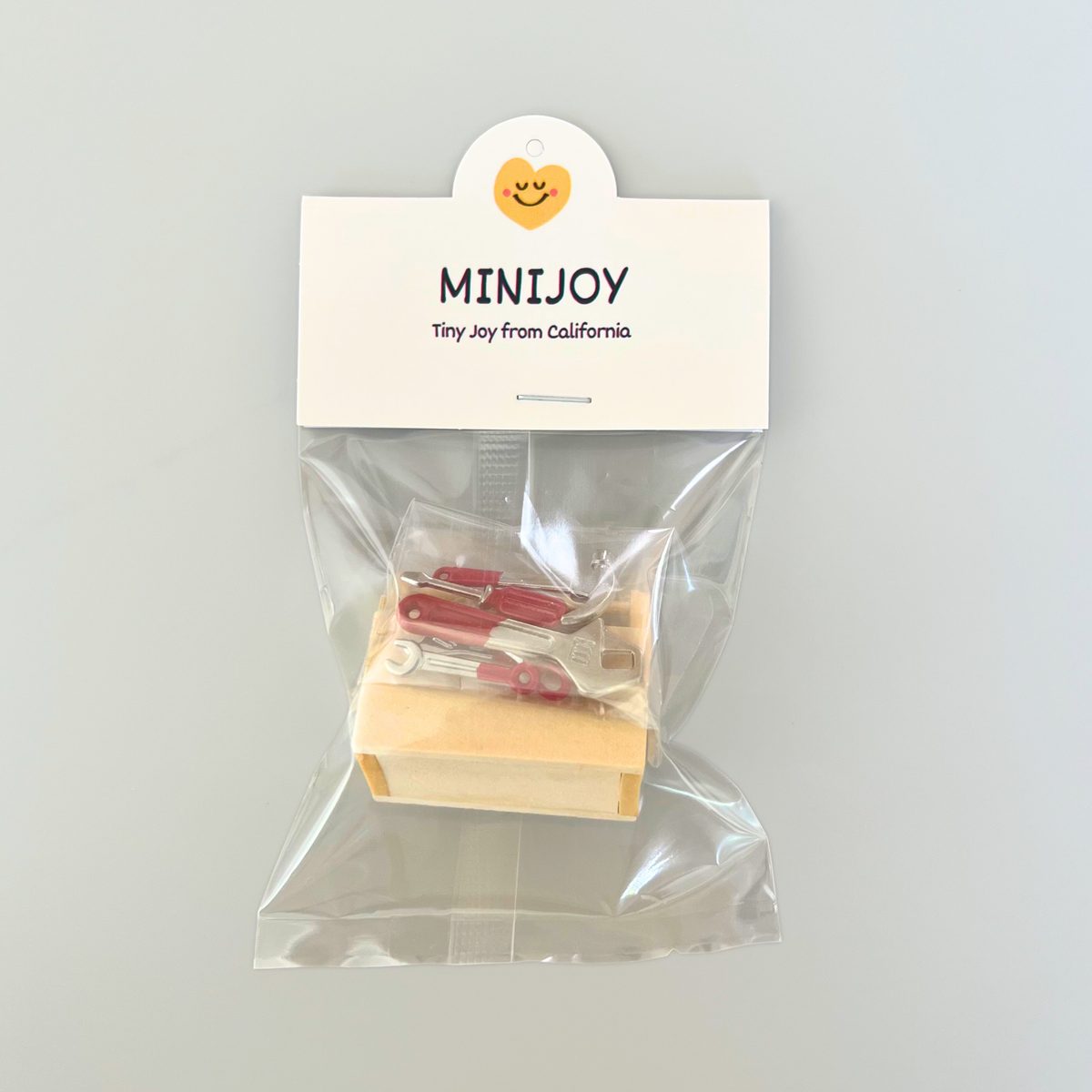 Packaged product with 'MINIJoy' label on a gray background