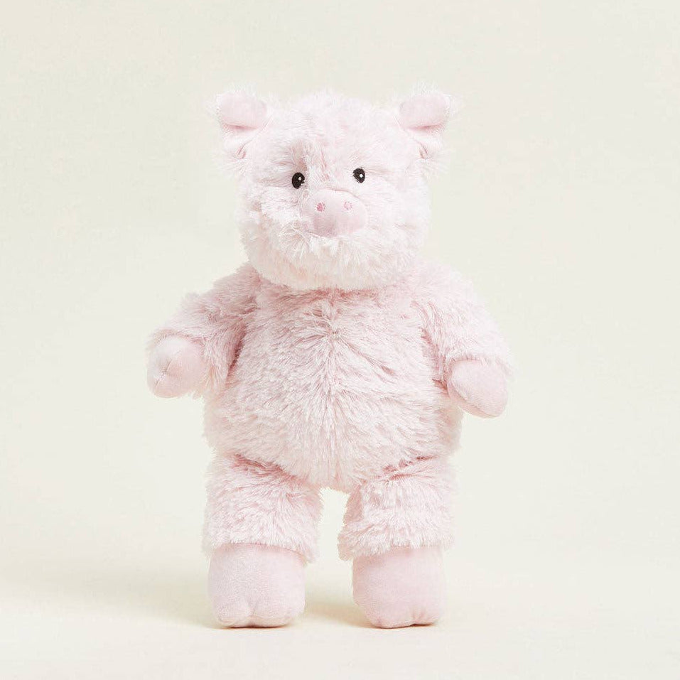 Pink plush bear toy on a white background
