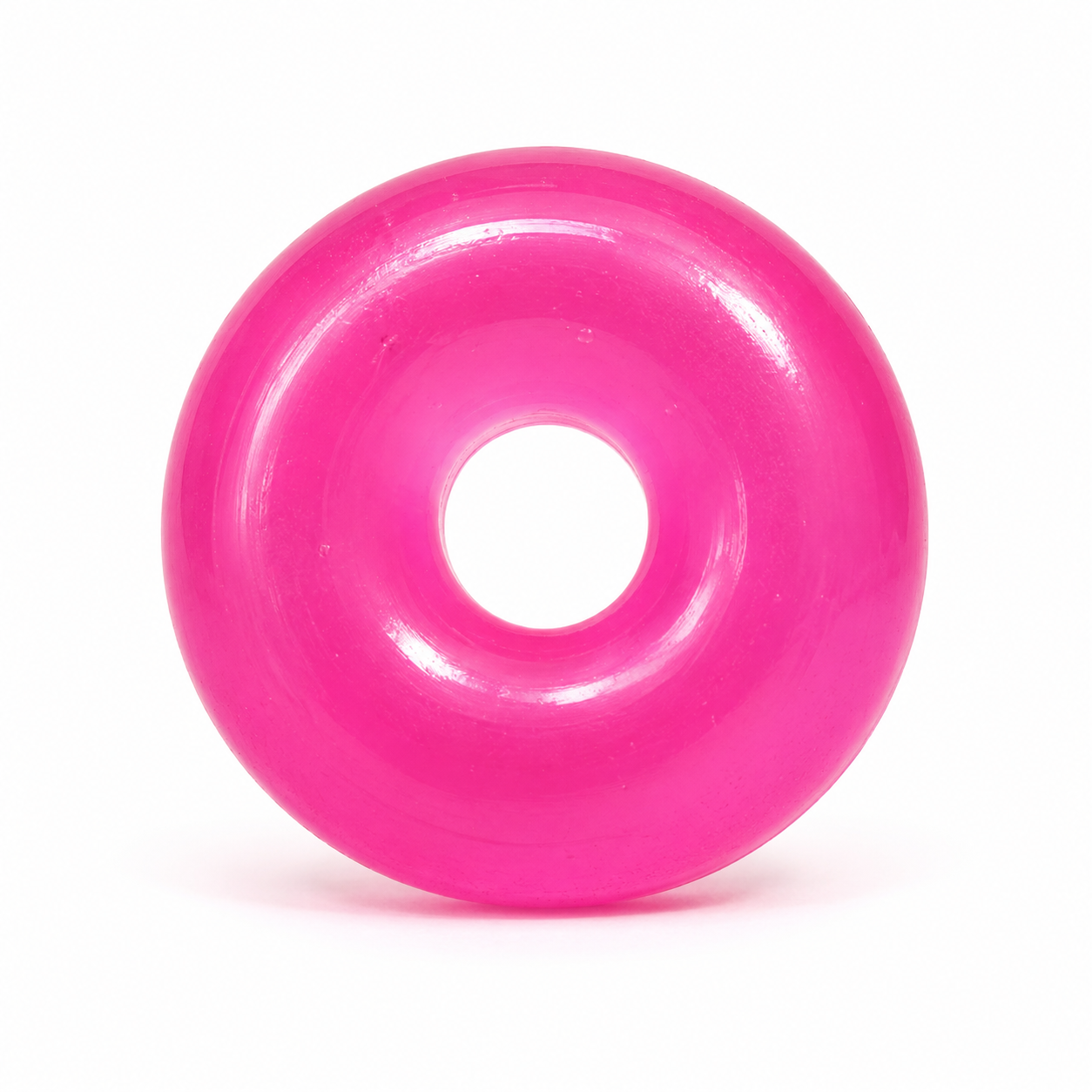 Pink donut-shaped object on a white background