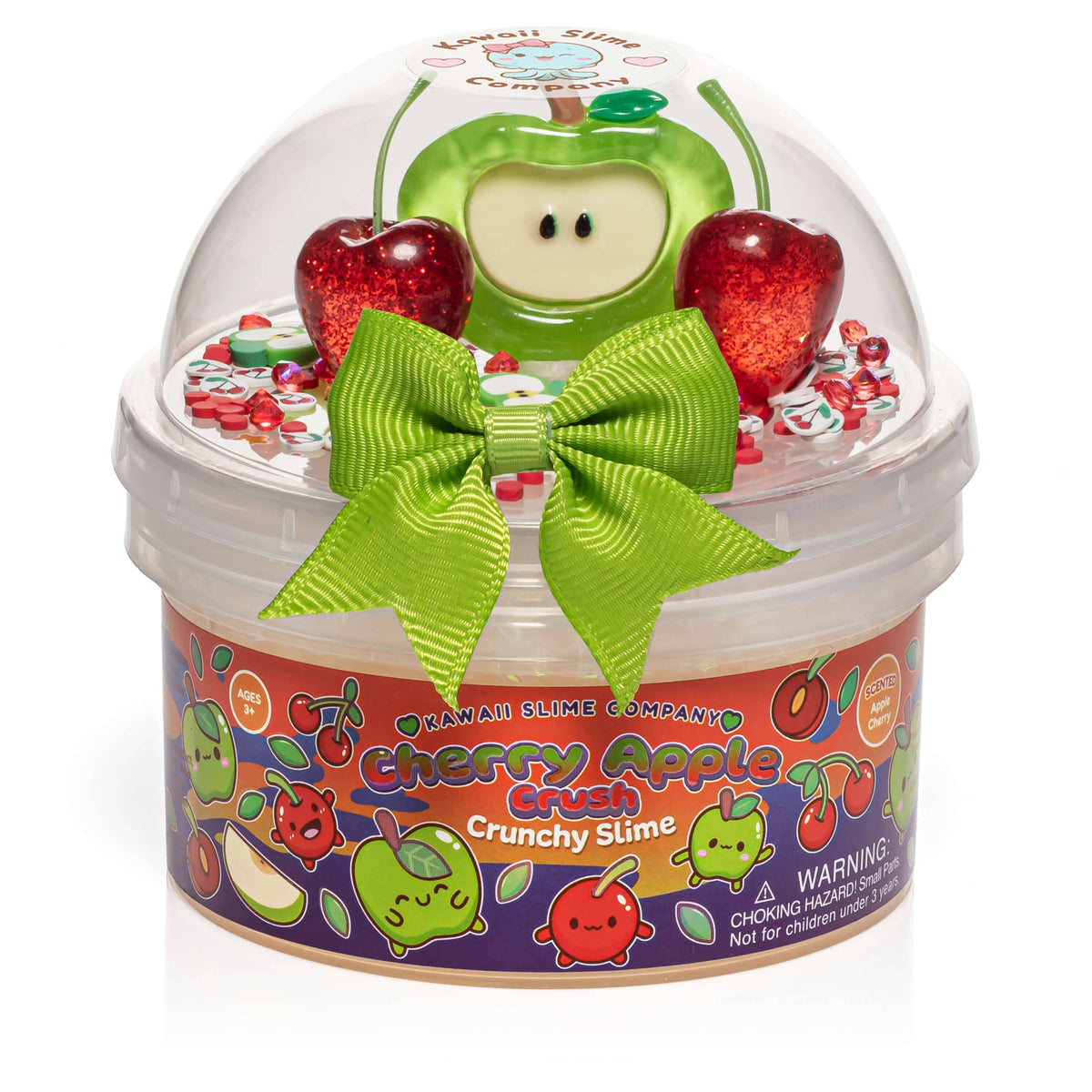 Cherry Apple Crunchy Slime by the Hawaiian Slime Company in a clear plastic dome container with a colorful label, decorated with a large green ribbon bow, a green apple character, and two red glittery cherries on top.