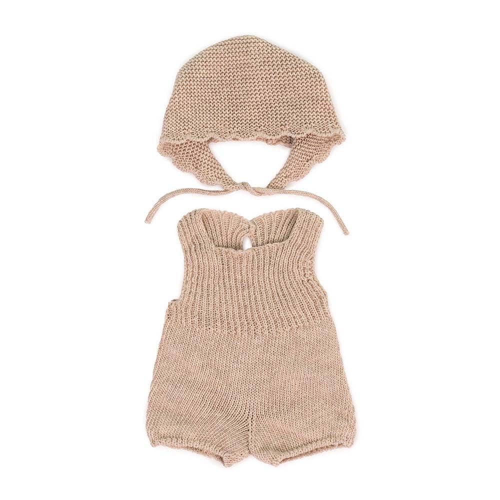 Knitted doll romper and bonnet set on a white background