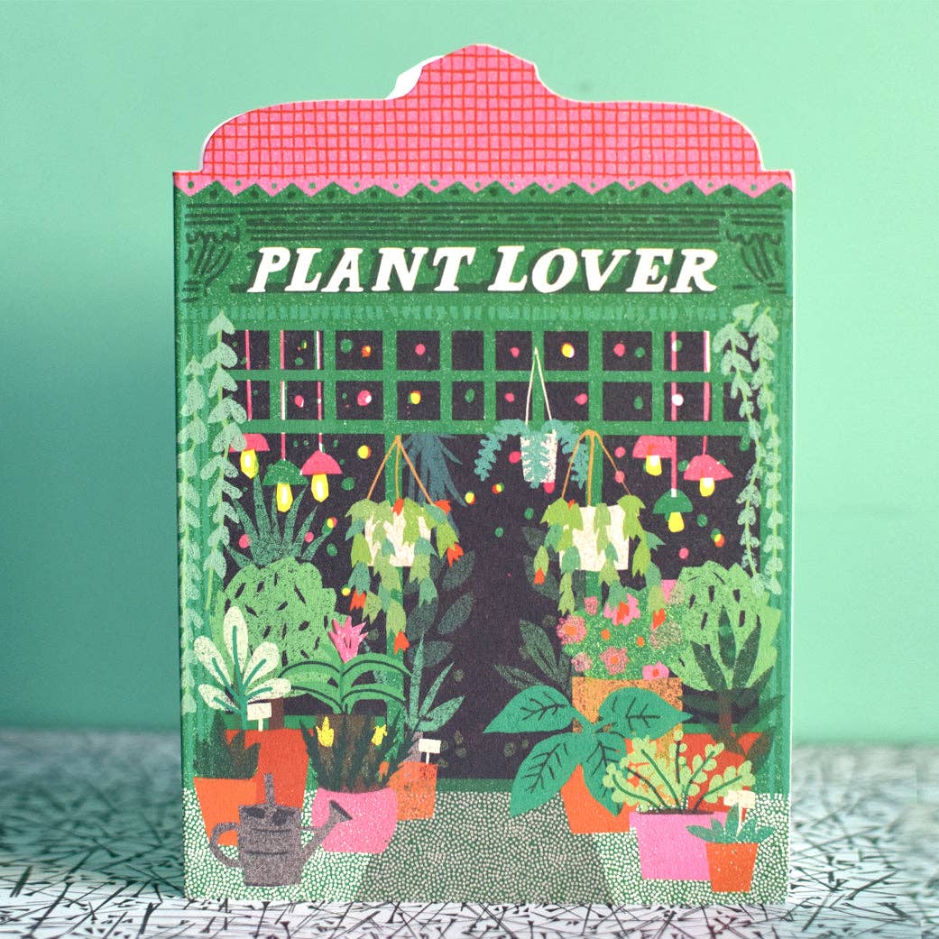 Card with 'Plant Lover' text and illustrations of plants on a green background