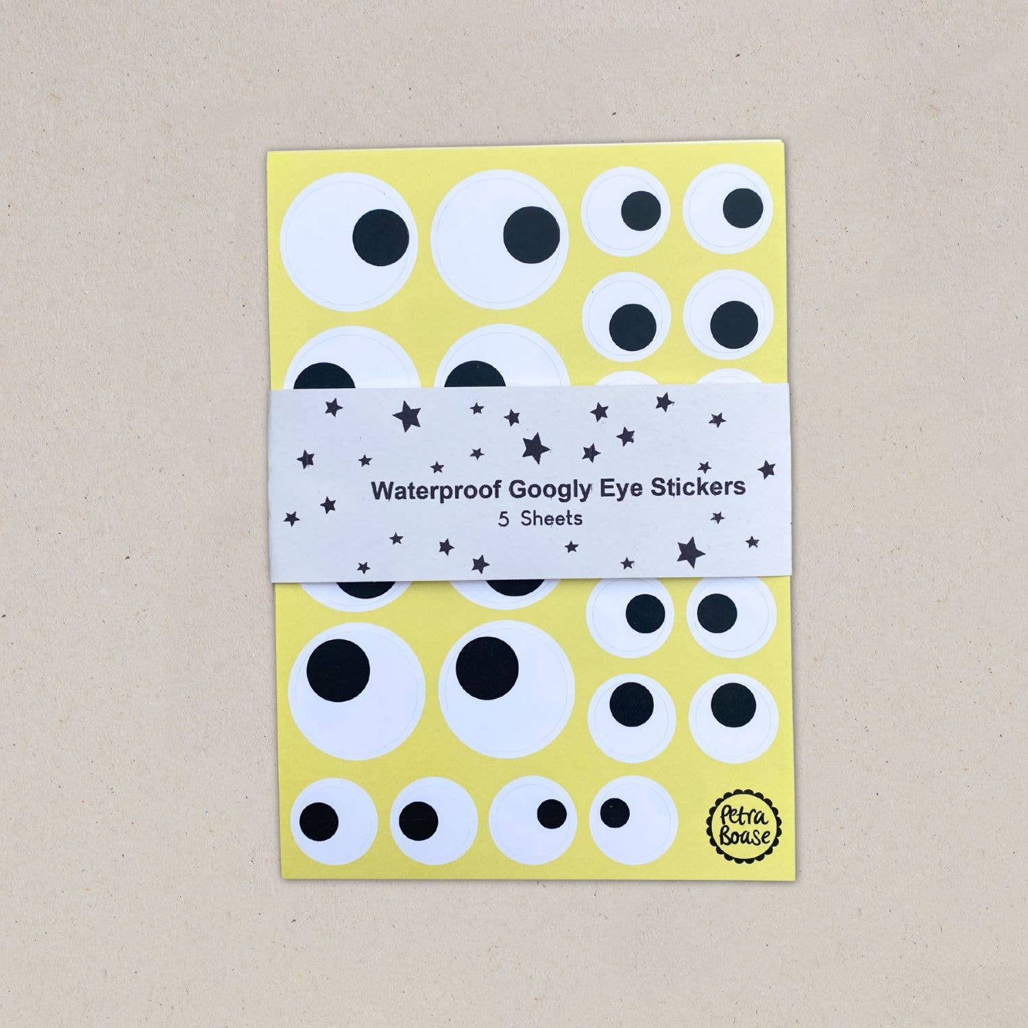 Pack of waterproof googly eye stickers with a yellow background and black and white eyes.