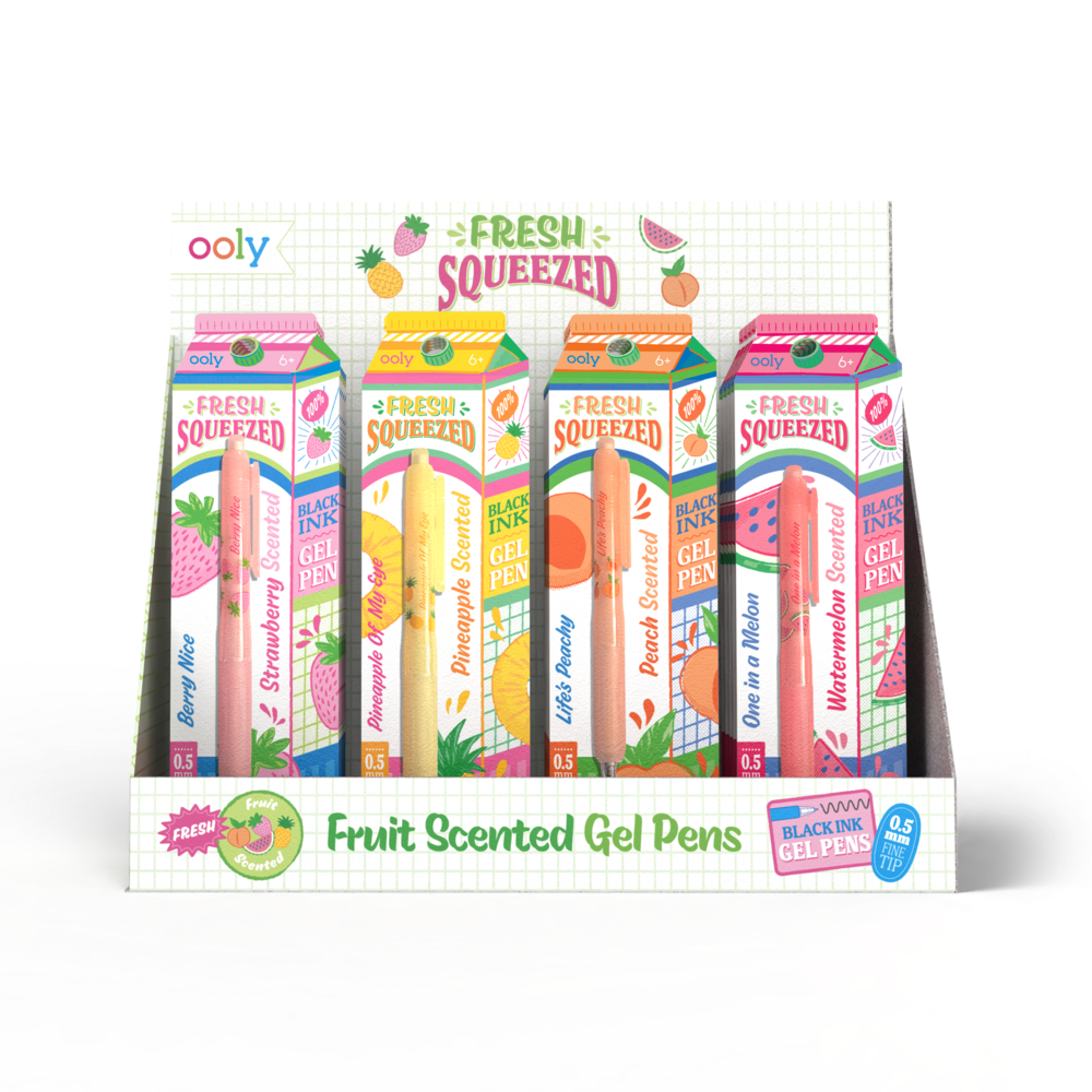 Display of fruit-scented gel pens in carton packaging with 'olly' branding.