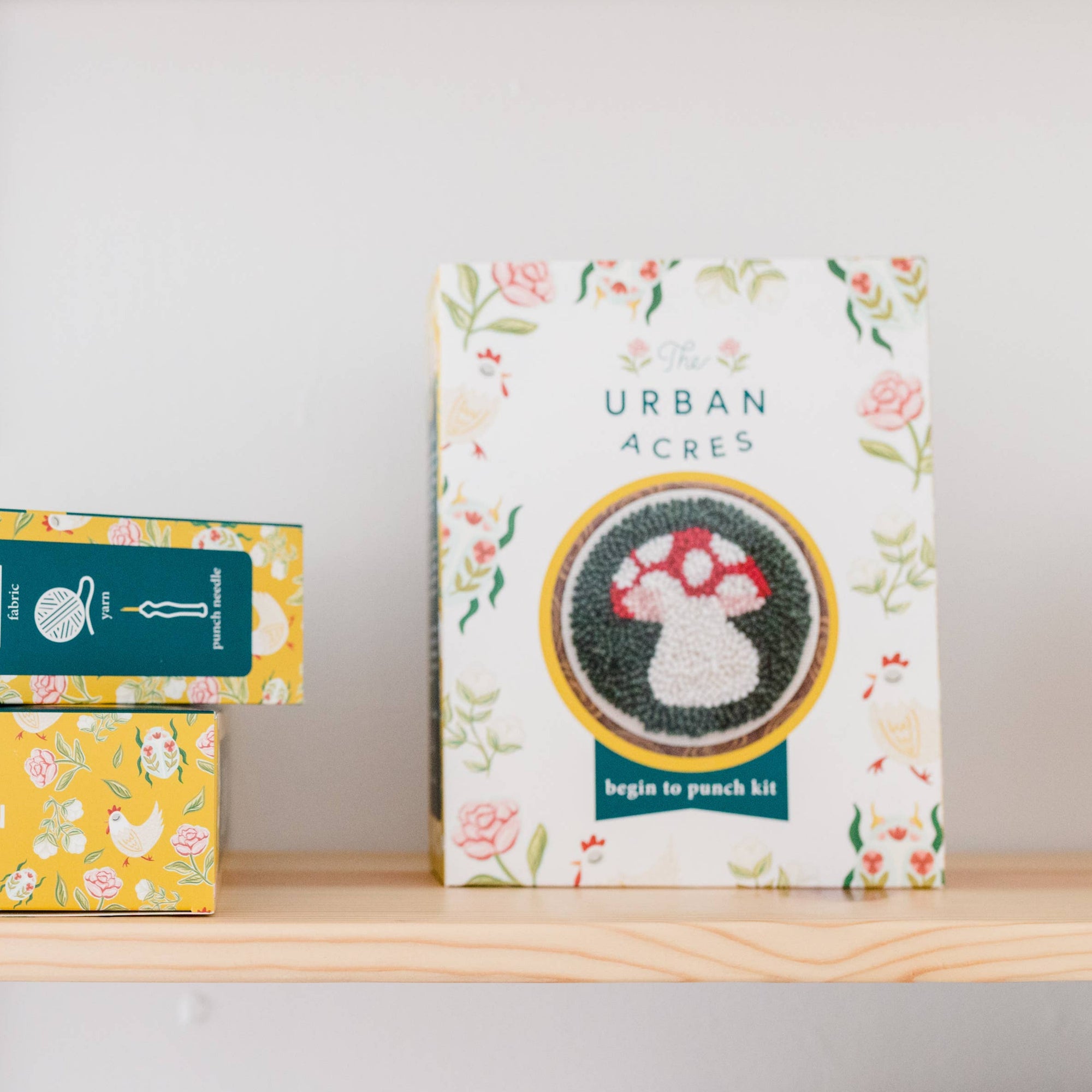 Two boxes from Urban Acres on a shelf with a white background