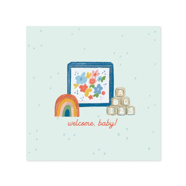 Baby-themed card with rainbow, flowers, and blocks on a light blue background