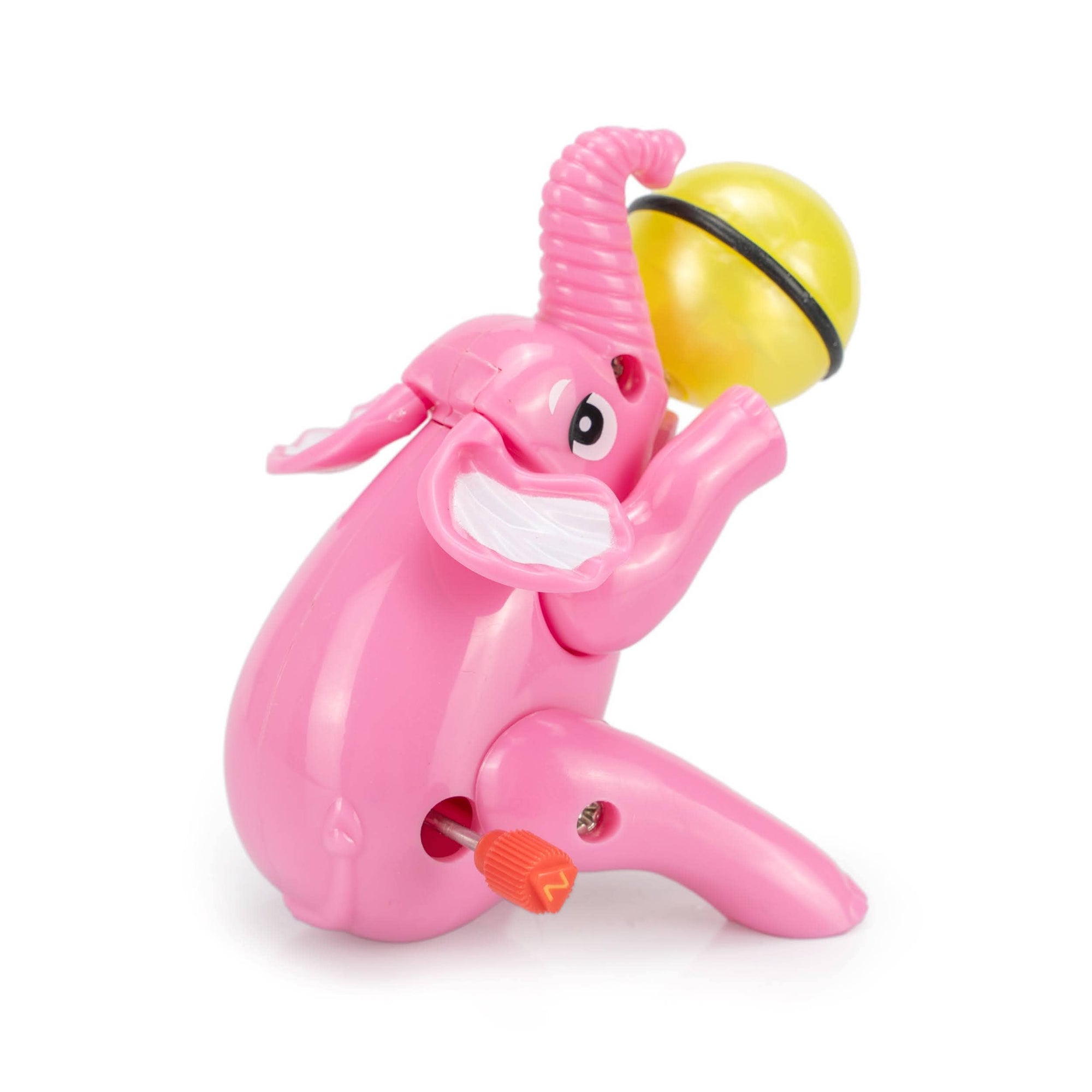 Pink toy monkey with a yellow ball on a white background